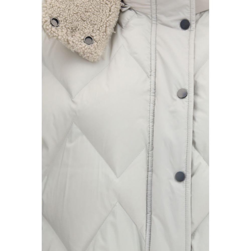 Elevate your wardrobe with the Brunello Cucinelli Gray Polyester Sleeveless Jacket, a luxurious blend of soft quilted craftsmanship and plush shearling-effect hood, perfect for modern elegance.