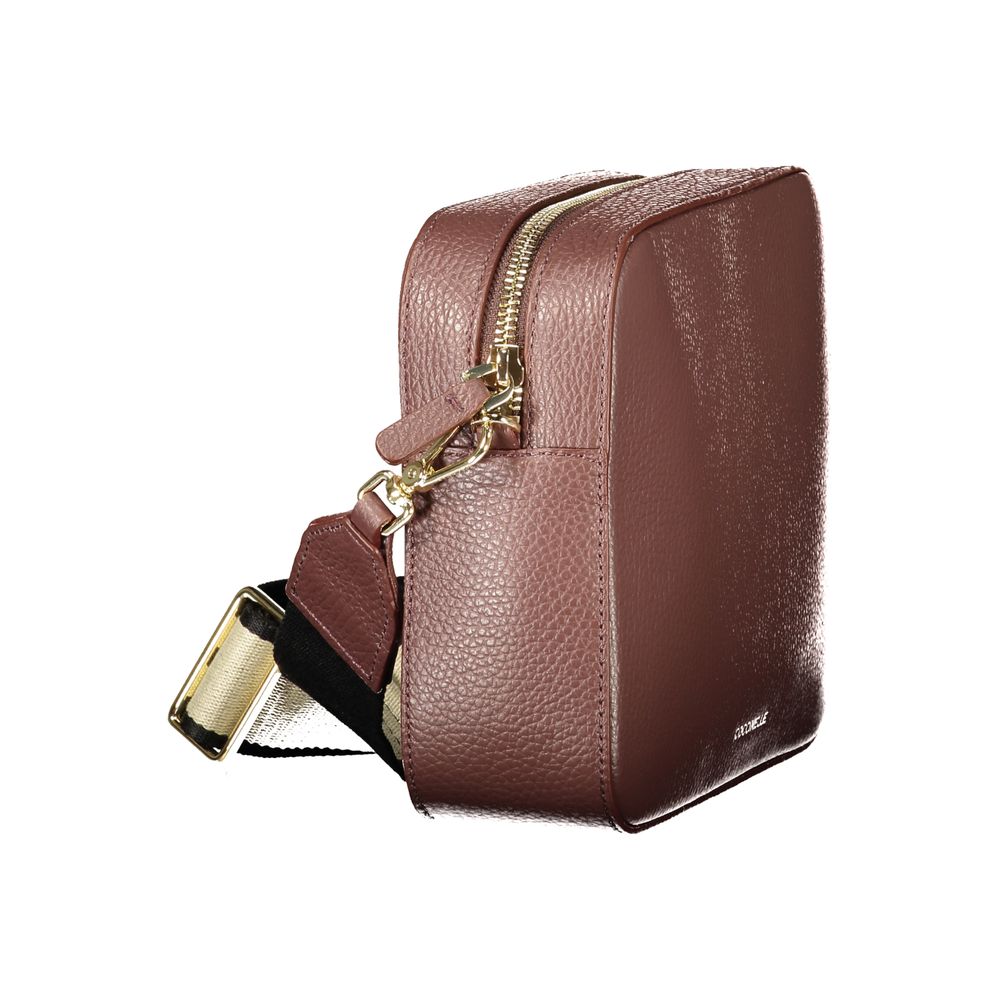 Elevate your style with the Coccinelle Brown Leather Handbag, a masterpiece of design featuring exquisite craftsmanship and luxurious details that embody sophistication.