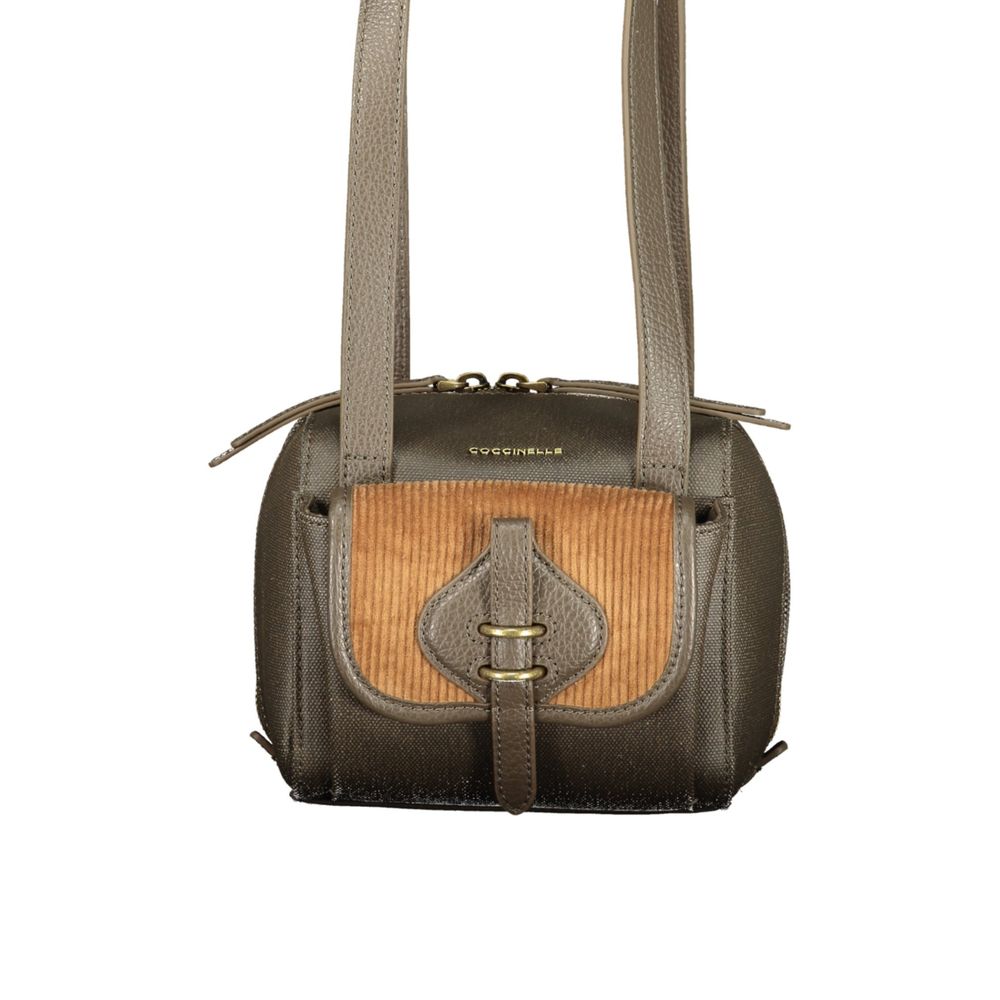 Indulge in the exquisite Coccinelle Brown Leather Handbag, a masterpiece of craftsmanship with contrasting details, designed for those who embody elegance and sophistication.