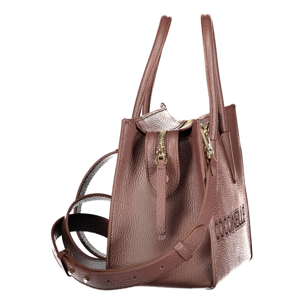 Indulge in the exquisite Coccinelle Brown Leather Handbag, a symbol of timeless elegance and masterful craftsmanship, perfect for the discerning individual.