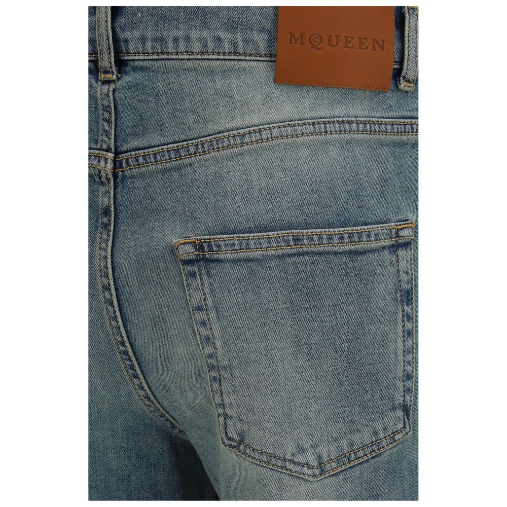 Elevate your wardrobe with the Alexander McQueen Blue Cotton Flared Jeans, featuring exquisite craftsmanship and a timeless silhouette that embodies luxury and sophistication.