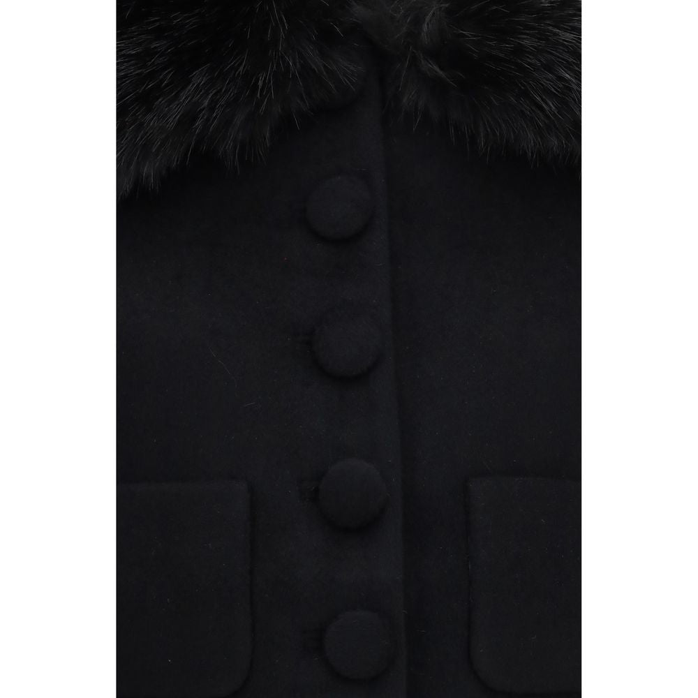 Indulge in the elegance of the Self-Portrait Black Wool Oves Aries Full-Length Jacket, crafted from luxurious merino wool, featuring detachable faux fur trims for a sophisticated allure.