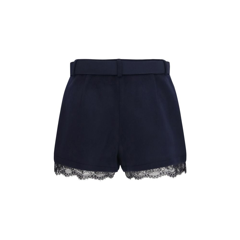 Experience the allure of Self-Portrait's Blue Wool Oves Aries Bermuda Shorts, a masterpiece of Merino wool and lace that epitomizes luxury and timeless elegance.