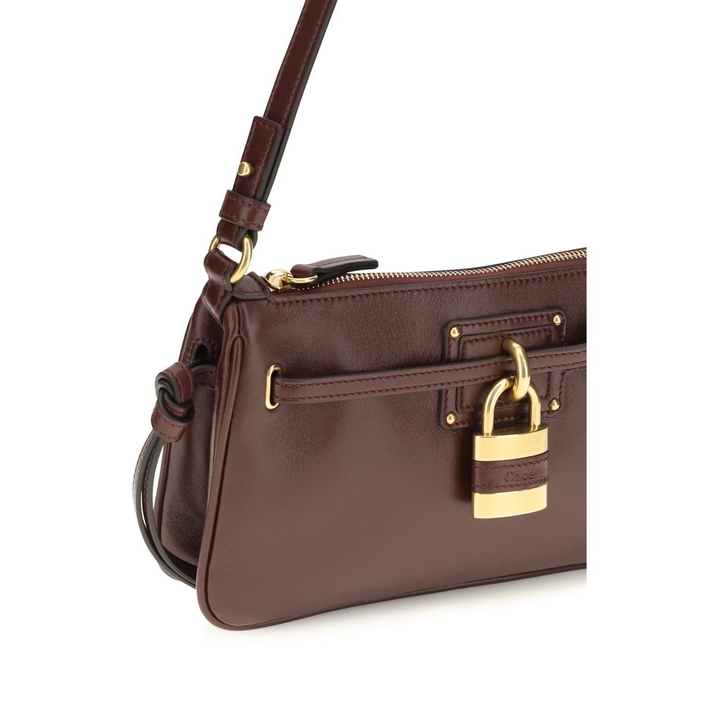 Indulge in the Chloé Bordeaux Calf Leather Bos Taurus Shoulder Bag, a masterpiece of exquisite craftsmanship and timeless elegance, perfect for the discerning connoisseur.