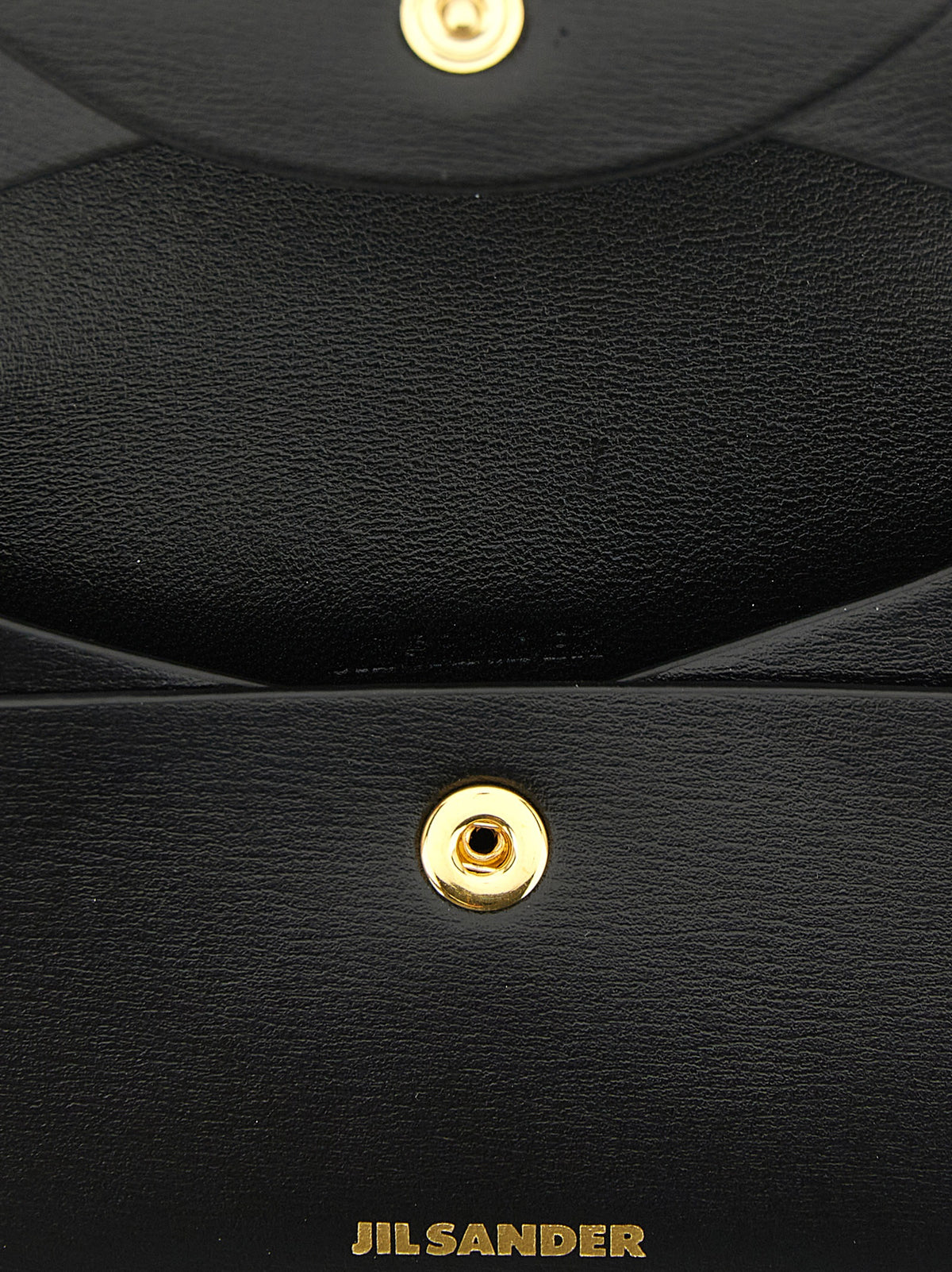 Elevate your accessory game with the Jil Sander Black Calfskin Cardholder, a timeless blend of exquisite craftsmanship and luxurious design, perfect for the discerning individual.