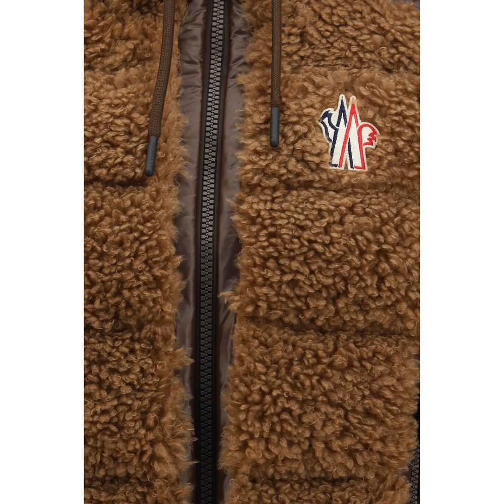 Indulge in the Moncler Grenoble Brown Polyamide Sleeveless Jacket, a masterpiece of craftsmanship featuring water-repellent treatment and goose-down insulation for unparalleled warmth and style.