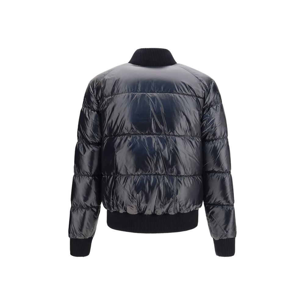 Indulge in the opulence of the Moose Knuckles Black Nylon Bomber, where plush down insulation meets sophisticated design for an unparalleled winter experience.