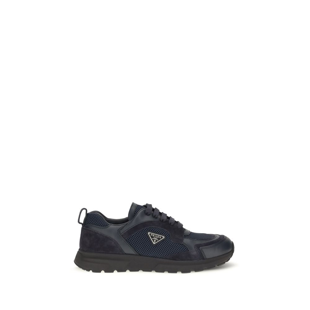 Indulge in the exquisite craftsmanship of Prada's Blue Fabric Athletic Sneakers, where luxurious materials meet a sophisticated design, perfect for the discerning individual.