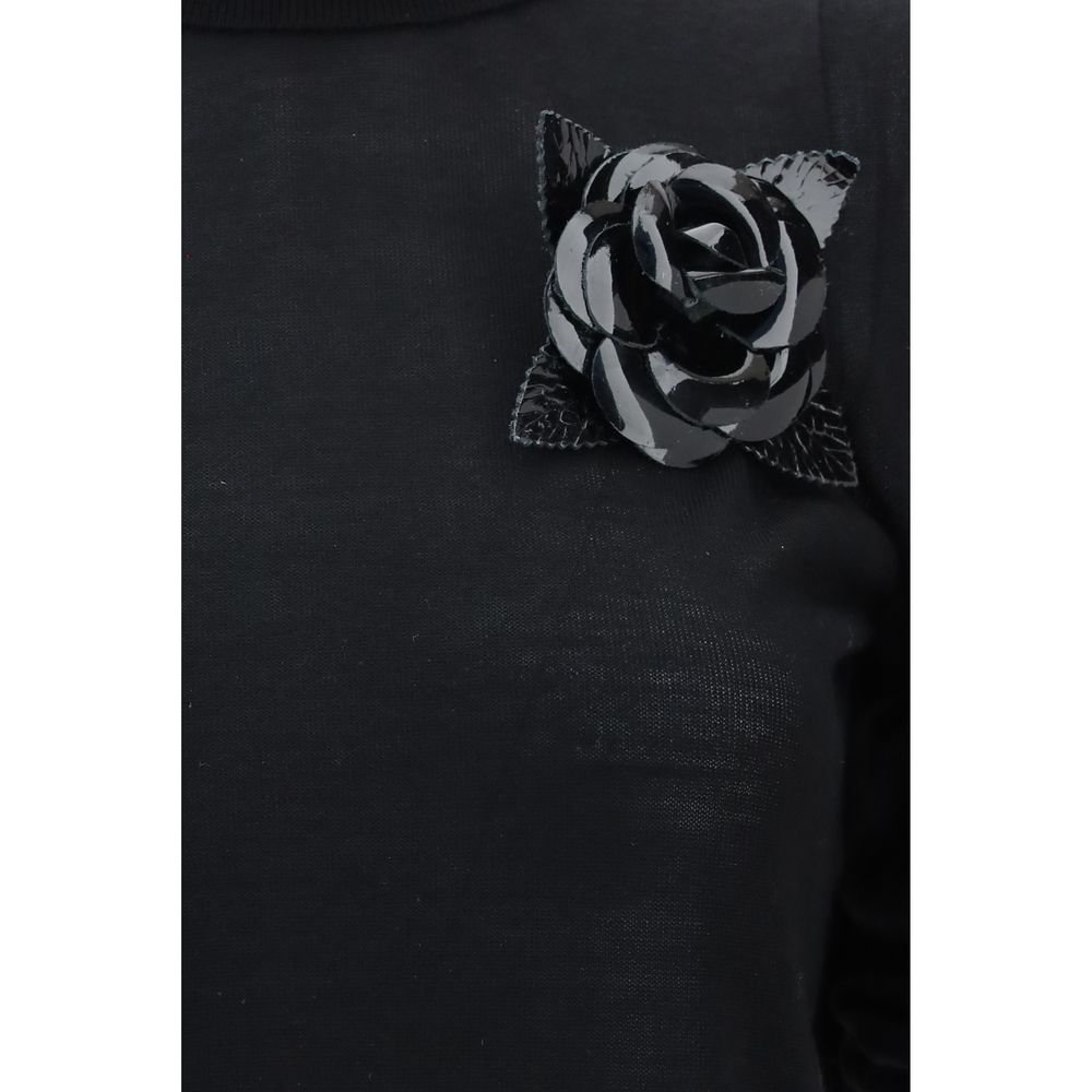 Elevate your wardrobe with the Blumarine Black Wool Oves Aries Turtleneck, crafted from luxurious fleece wool, where exquisite design meets timeless sophistication for a statement of elegance.