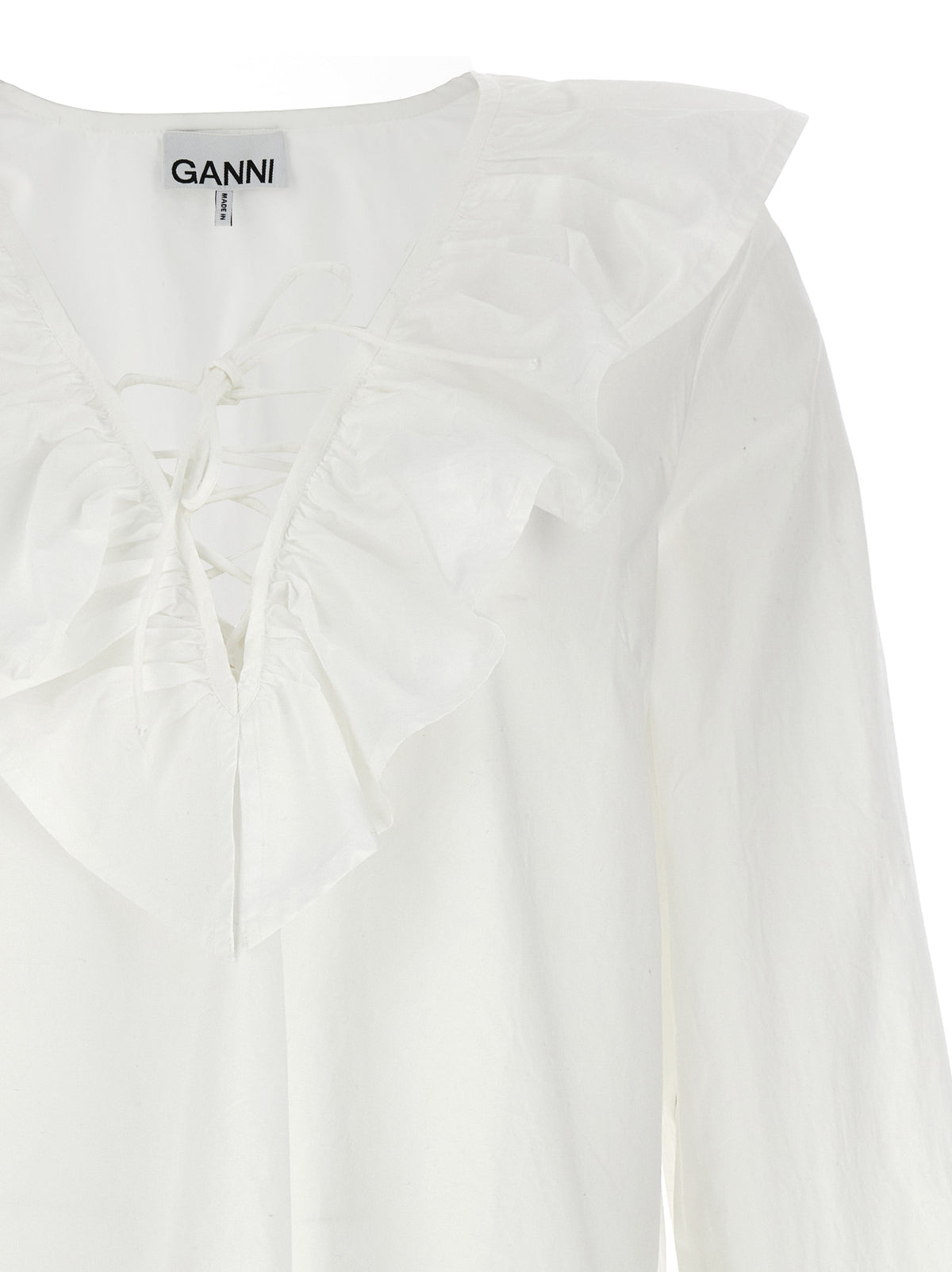 Elevate your elegance with the Ganni White Cotton Blouse, a masterpiece of refined design and luxurious comfort, perfect for any sophisticated occasion.