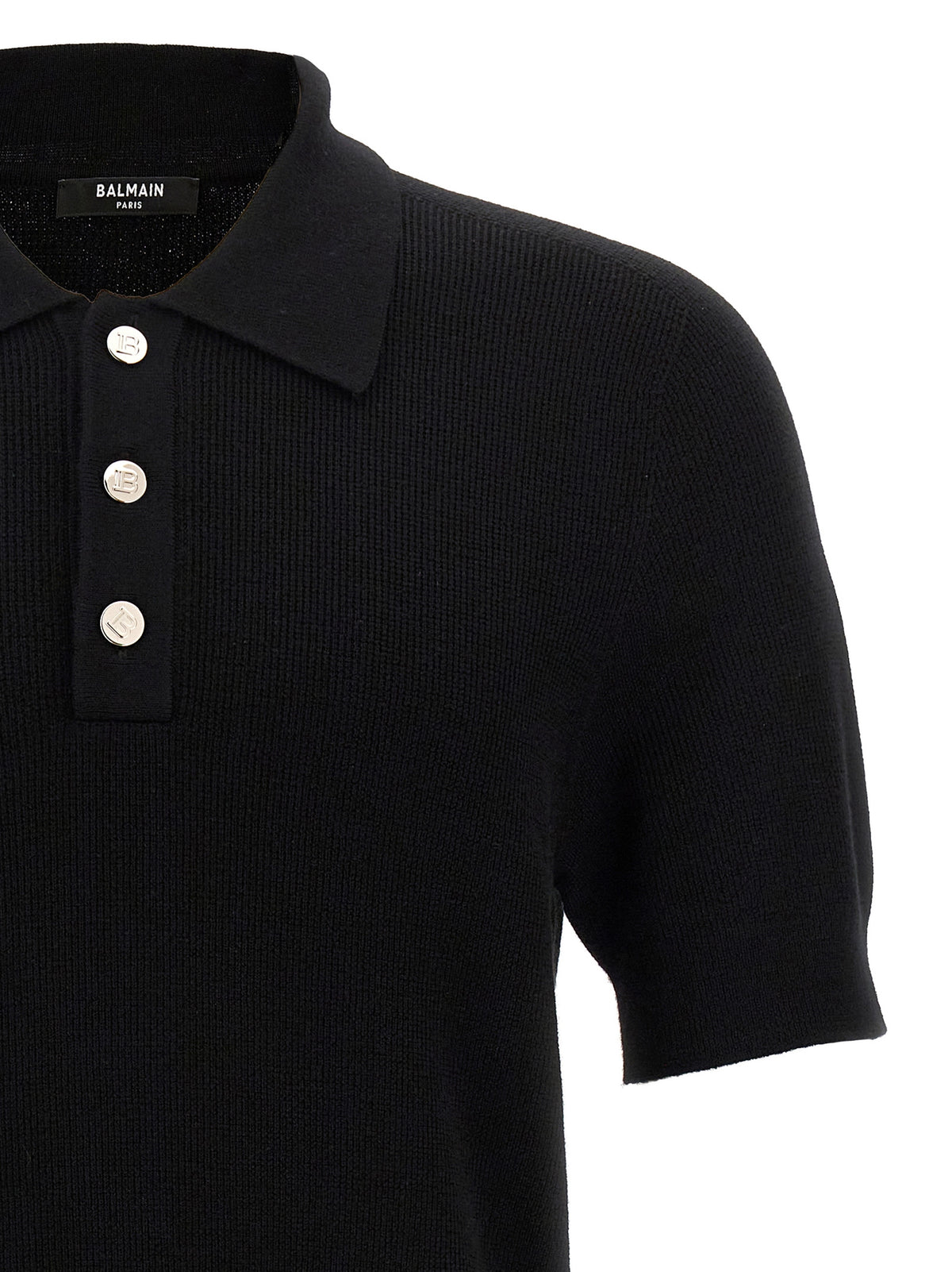 Indulge in the elegance of the Balmain Black Merino Wool Polo Shirt, a luxurious statement piece that embodies sophistication and timeless allure for discerning fashion connoisseurs.