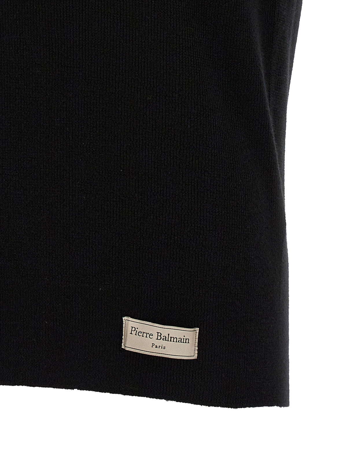 Indulge in the exquisite allure of the Balmain Black Merino Wool Polo Shirt, a testament to Italian craftsmanship that elevates your wardrobe with timeless elegance.