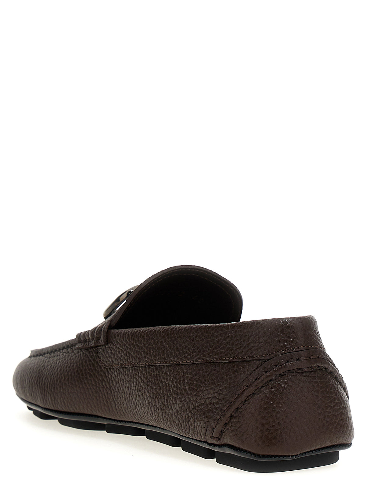 Discover the allure of Valentino Garavani's Brown Calfskin Slip-On Loafers, where exquisite Italian craftsmanship meets timeless elegance, elevating your style to new heights.