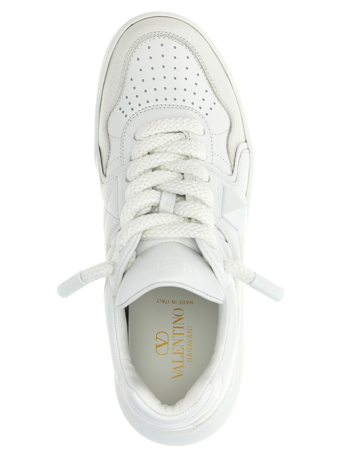 Elevate your style with Valentino Garavani's White Lamb Leather Low Top Sneakers, where luxurious craftsmanship meets bold sophistication for the discerning individual.