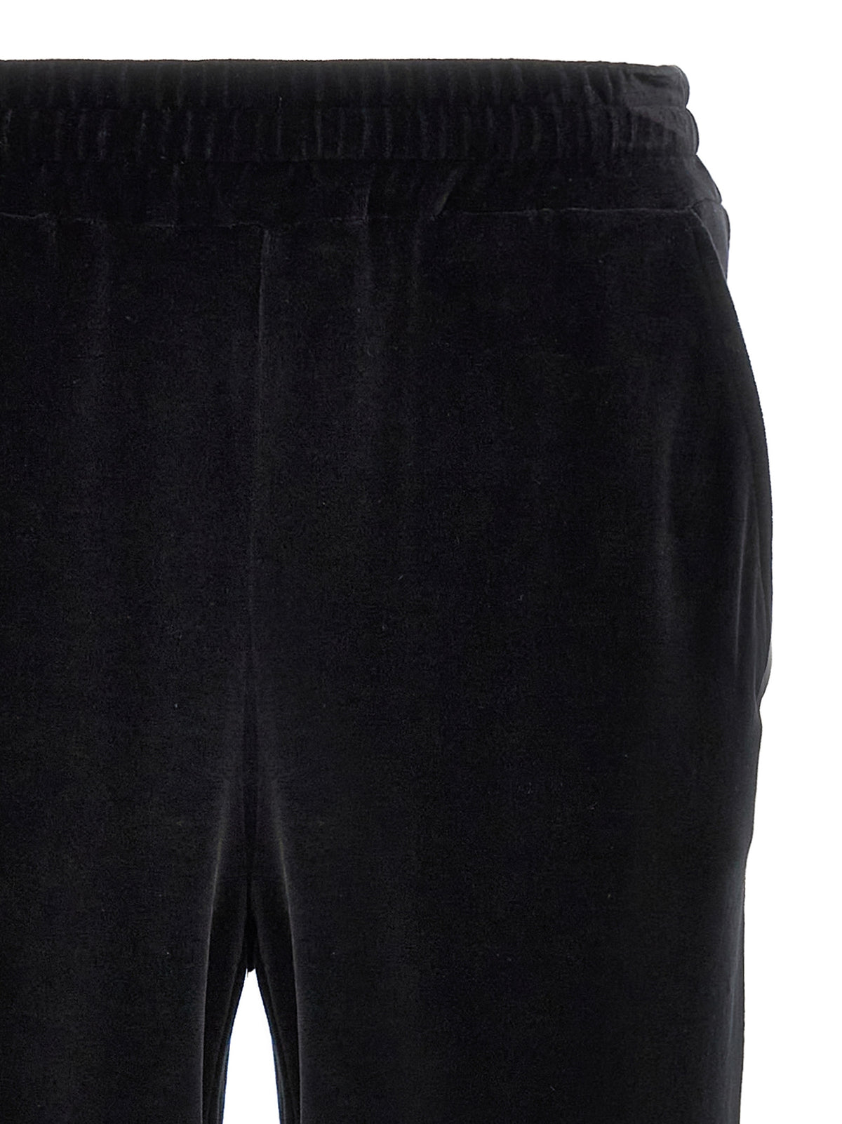 Indulge in the elegance of Dolce & Gabbana's Black 'Sicily' Chenille Joggers, where luxurious cotton meets sophisticated design, perfect for the discerning individual.