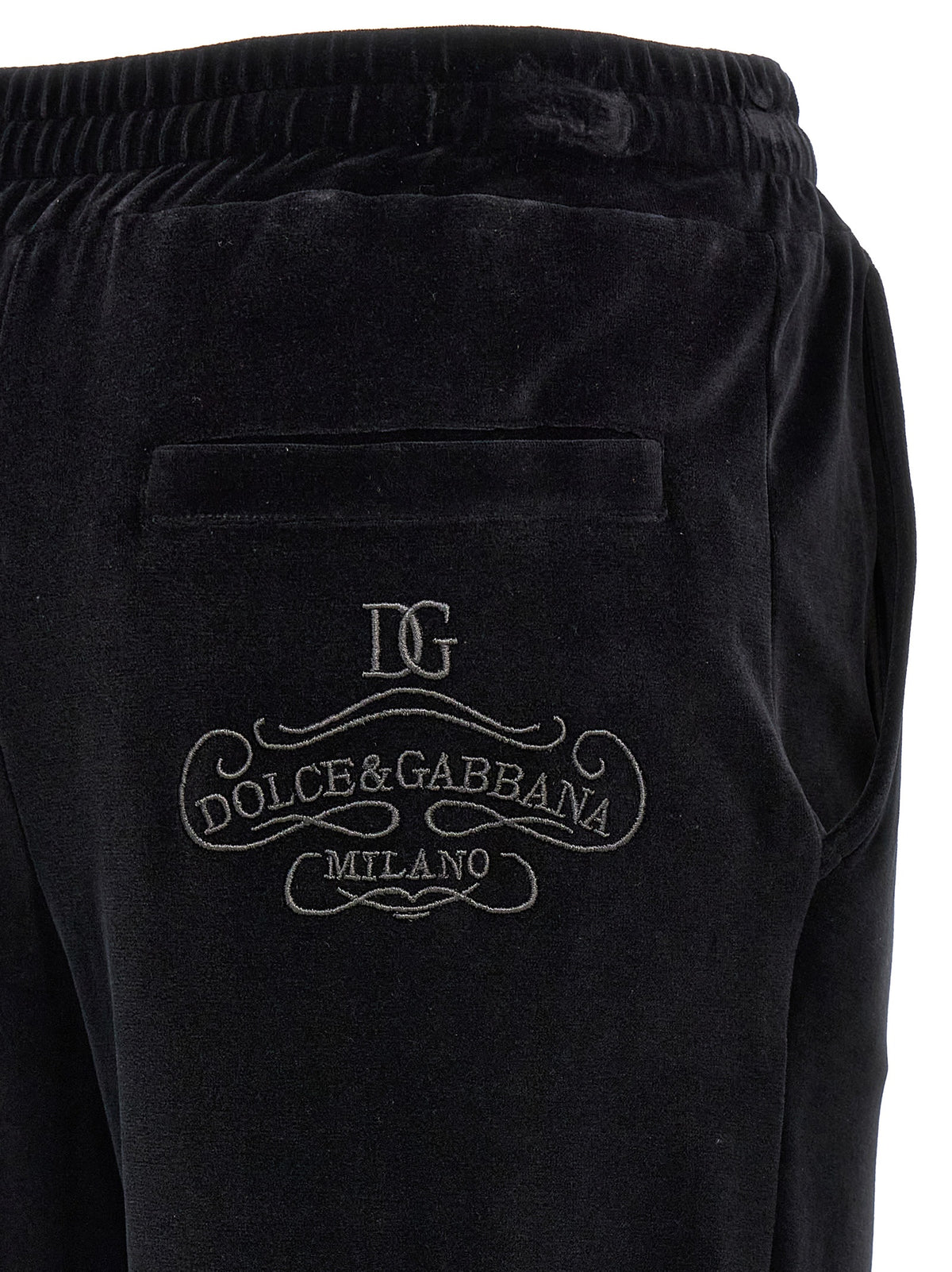 Indulge in the exquisite elegance of Dolce & Gabbana's Black 'Sicily' Chenille Joggers, crafted in Italy for those who embody luxury and sophistication.