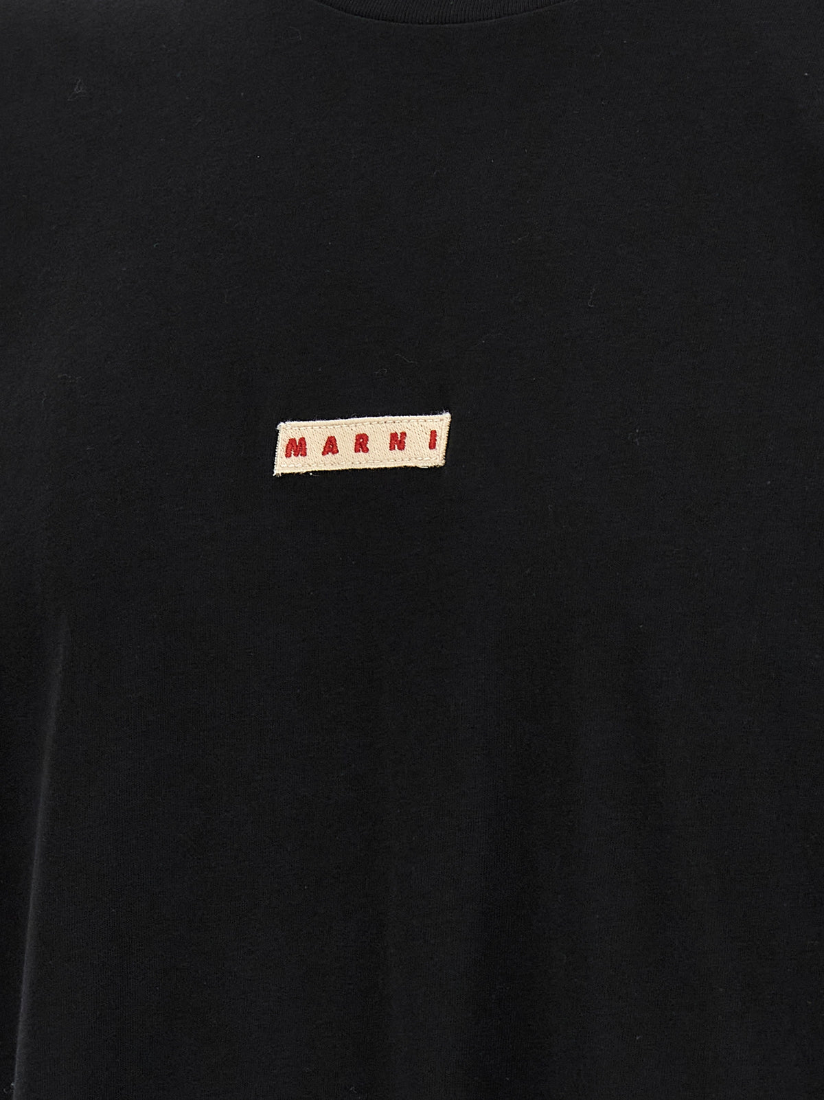 Elevate your wardrobe with the Marni Black Cotton T-Shirt, a statement piece crafted for those who embrace bold fashion and effortless sophistication.