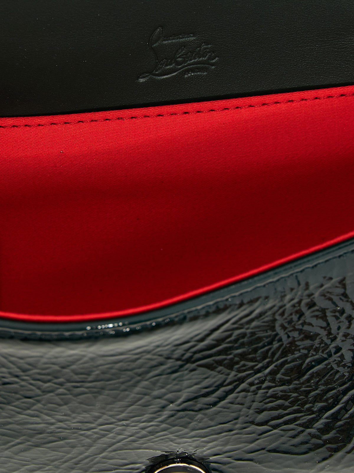 Discover the exquisite Christian Louboutin Bicolor Calfskin Crossbody Bag, a luxurious statement piece crafted from premium leather, perfect for the discerning fashion connoisseur.