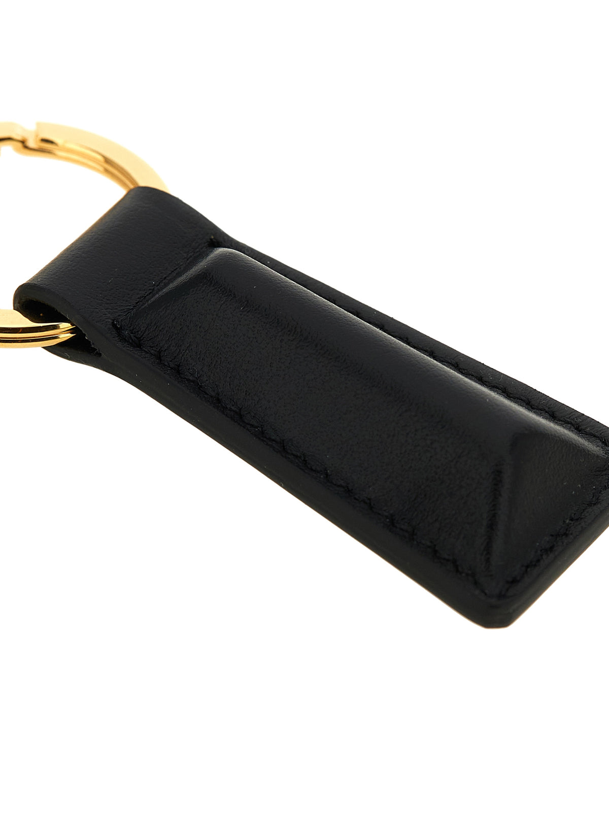 Discover the Jil Sander Black Calfskin Keychain, a symbol of refined elegance crafted from premium leather, perfect for those who appreciate exquisite design and timeless luxury.