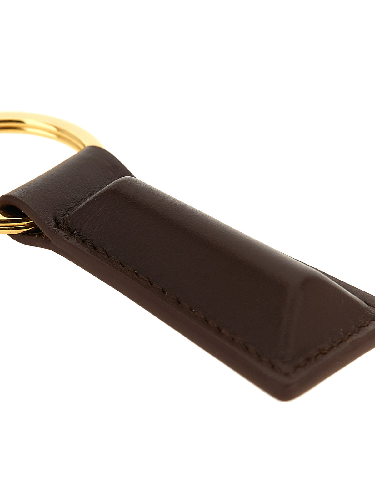 Discover the Jil Sander Brown Calfskin Keychain, a masterpiece of exquisite craftsmanship and timeless elegance, perfect for those who appreciate luxury and sophistication.