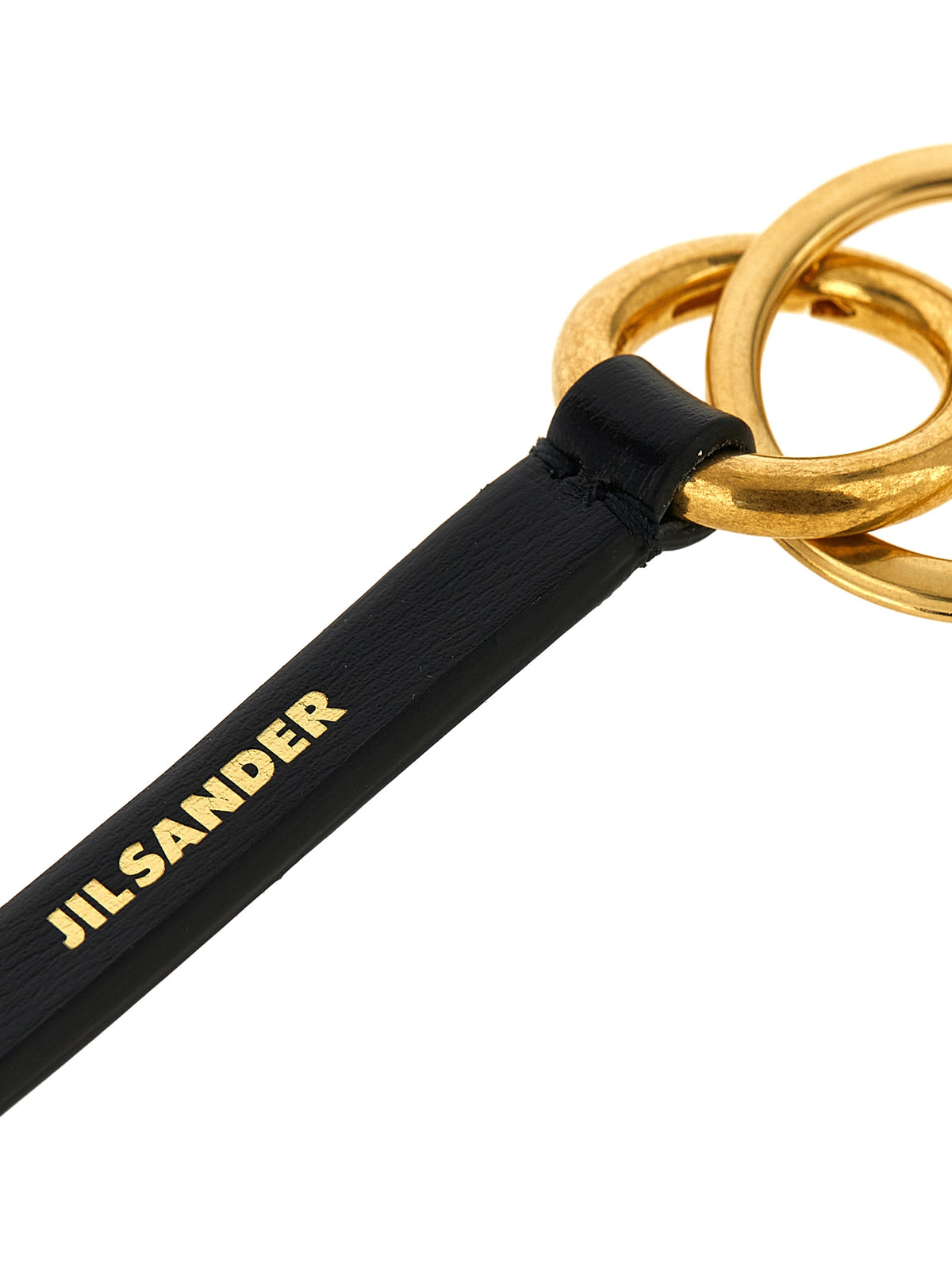 Discover the Jil Sander Black Calfskin Keychain, a symbol of contemporary luxury crafted from premium leather, elevating your essentials with exquisite artistry and timeless elegance.