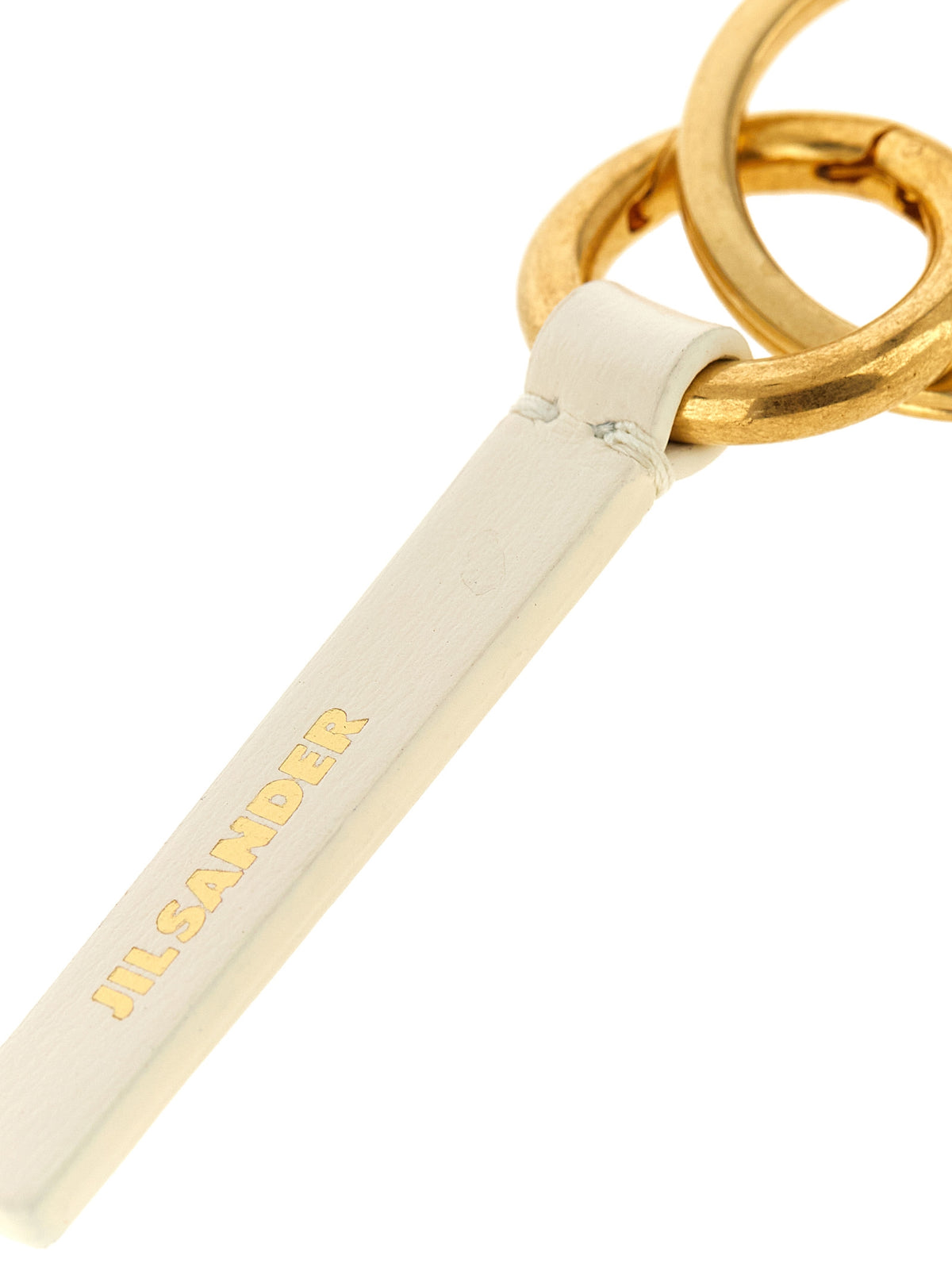 Discover the Jil Sander White Calfskin Keychain, a symbol of exquisite craftsmanship and timeless elegance, perfect for those who appreciate refined luxury.