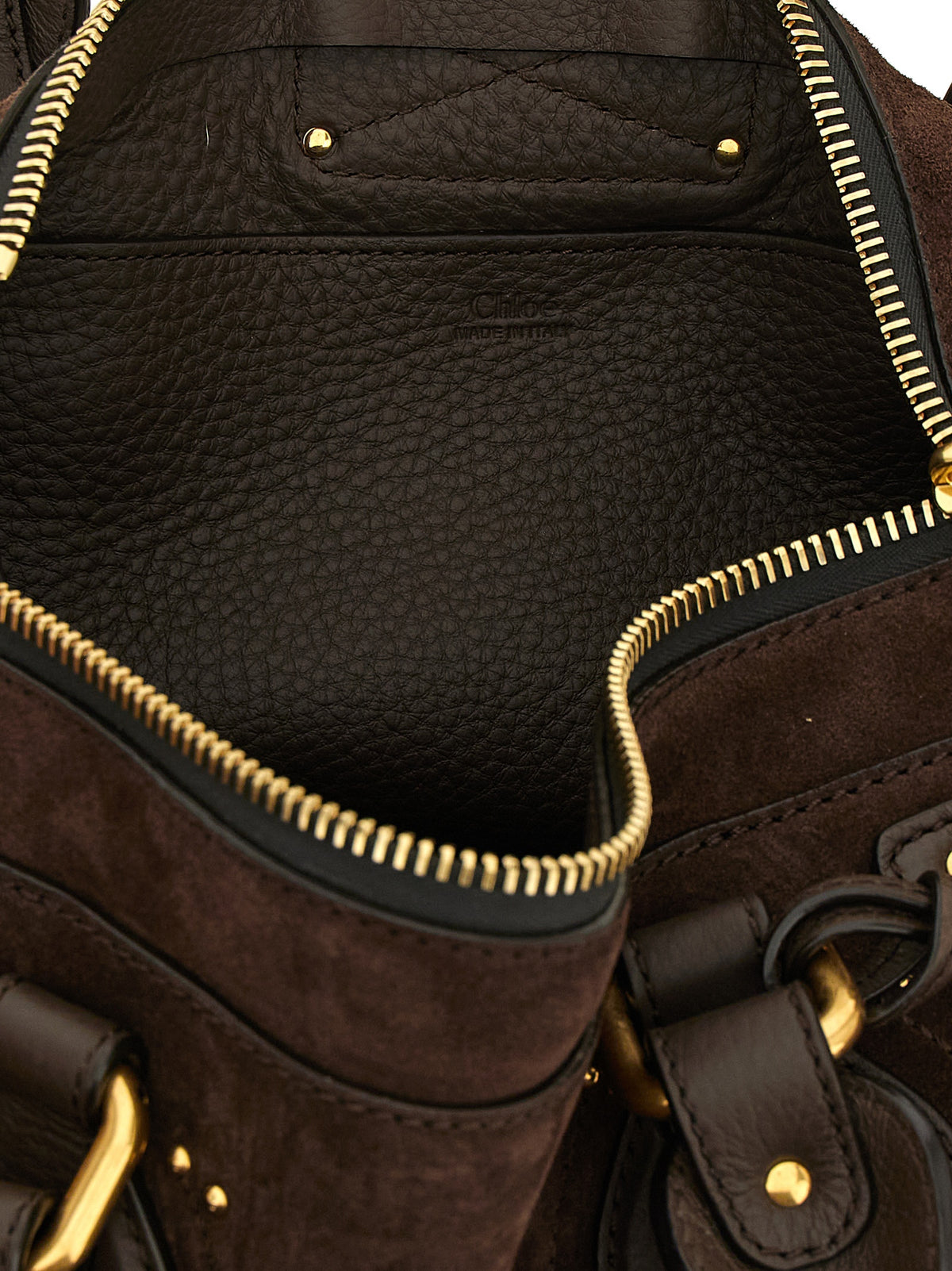 Elevate your style with the Chloé Brown Calfskin Shoulder Bag, a masterpiece of deconstructed elegance and luxurious craftsmanship, perfect for the discerning fashionista.