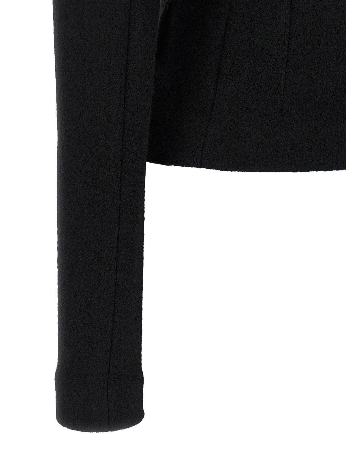 Elevate your wardrobe with the Dolce & Gabbana Black Virgin Wool Blazer, a masterpiece of Italian craftsmanship that embodies sophistication and timeless elegance.