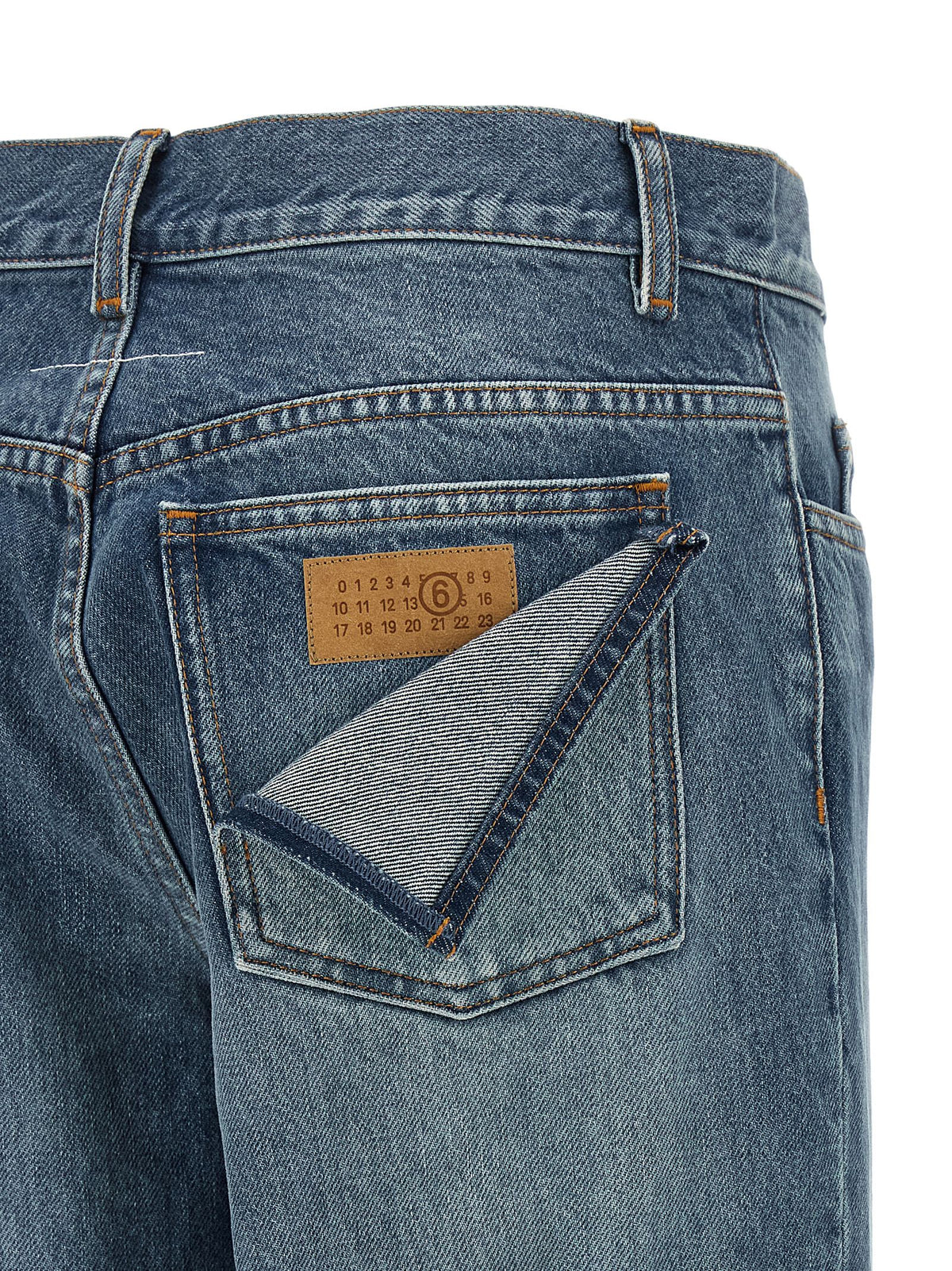 Elevate your wardrobe with MM6 Maison Margiela's Blue Cotton Straight-Leg Jeans, where innovative design meets timeless elegance, embodying the essence of luxury and individuality.