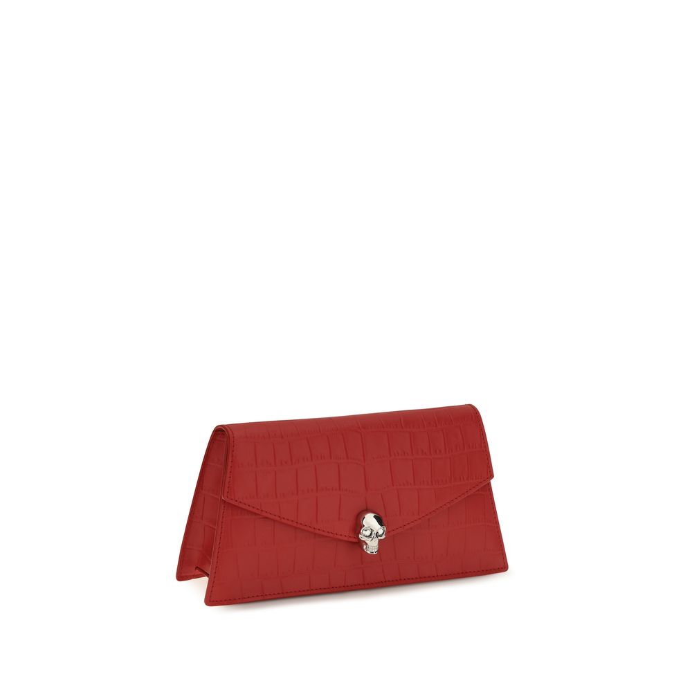 Elevate your style with the Alexander McQueen Red Calf Leather Bos Taurus Clutch Bag, a masterpiece of crocodile-embossed luxury that embodies sophistication and allure.