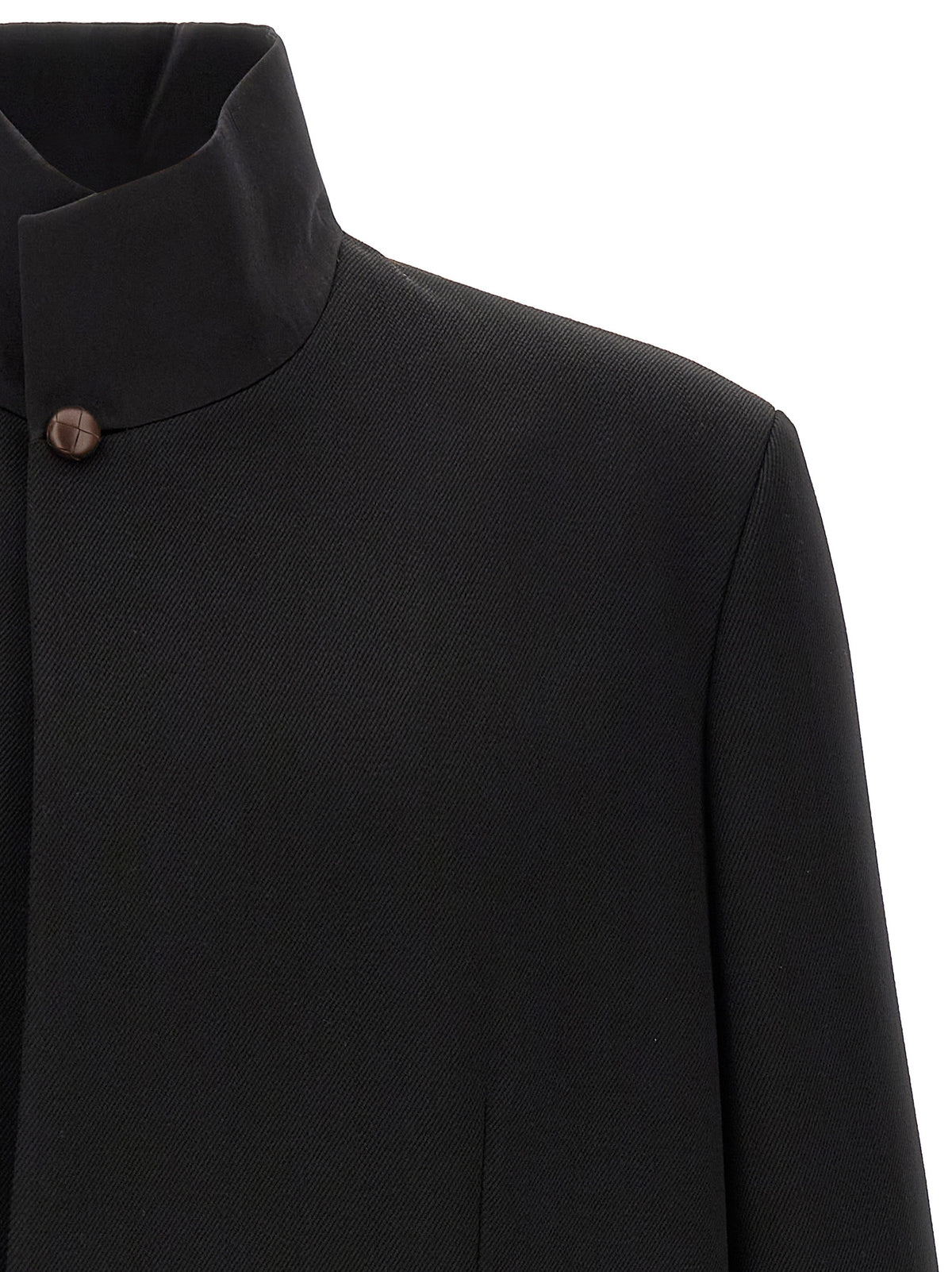 Indulge in the sophistication of ZEGNA's black wool blazer, a timeless piece that marries exquisite craftsmanship with contemporary elegance, perfect for the discerning individual.