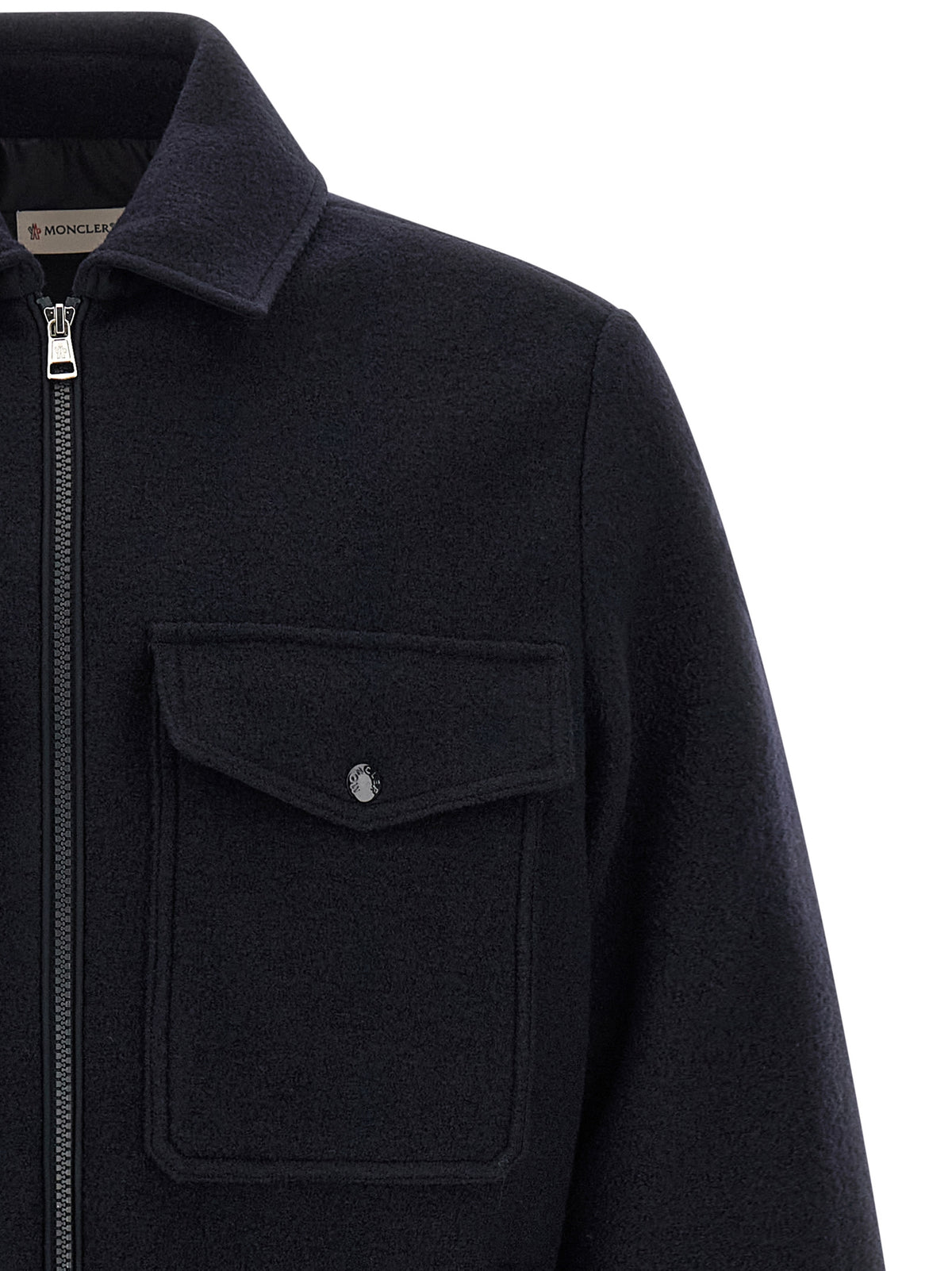 Indulge in the exquisite Moncler Blue Virgin Wool Blouse, a timeless piece crafted from pure virgin wool, embodying sophistication and elegance for discerning tastes.