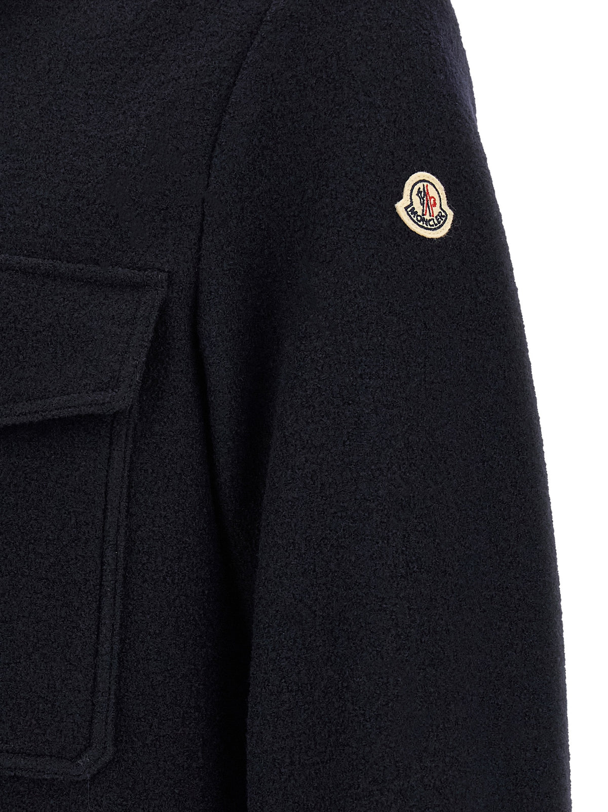 Elevate your wardrobe with Moncler's Blue Virgin Wool Blouse, a masterclass in sophistication and comfort, crafted from pure virgin wool for timeless elegance.
