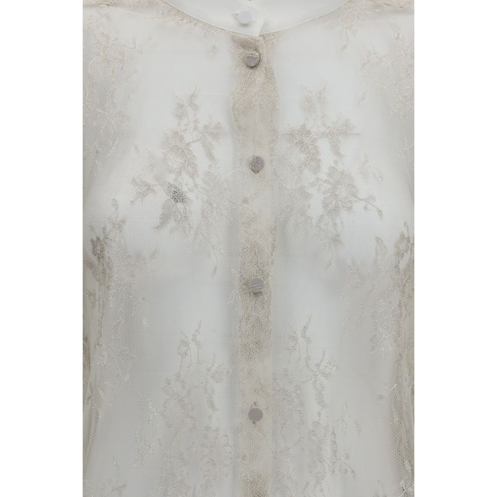 Indulge in the exquisite allure of the Tom Ford Beige Polyamide Blouse, a sheer lace masterpiece adorned with floral embroidery, perfect for those who embody elegance and sophistication.