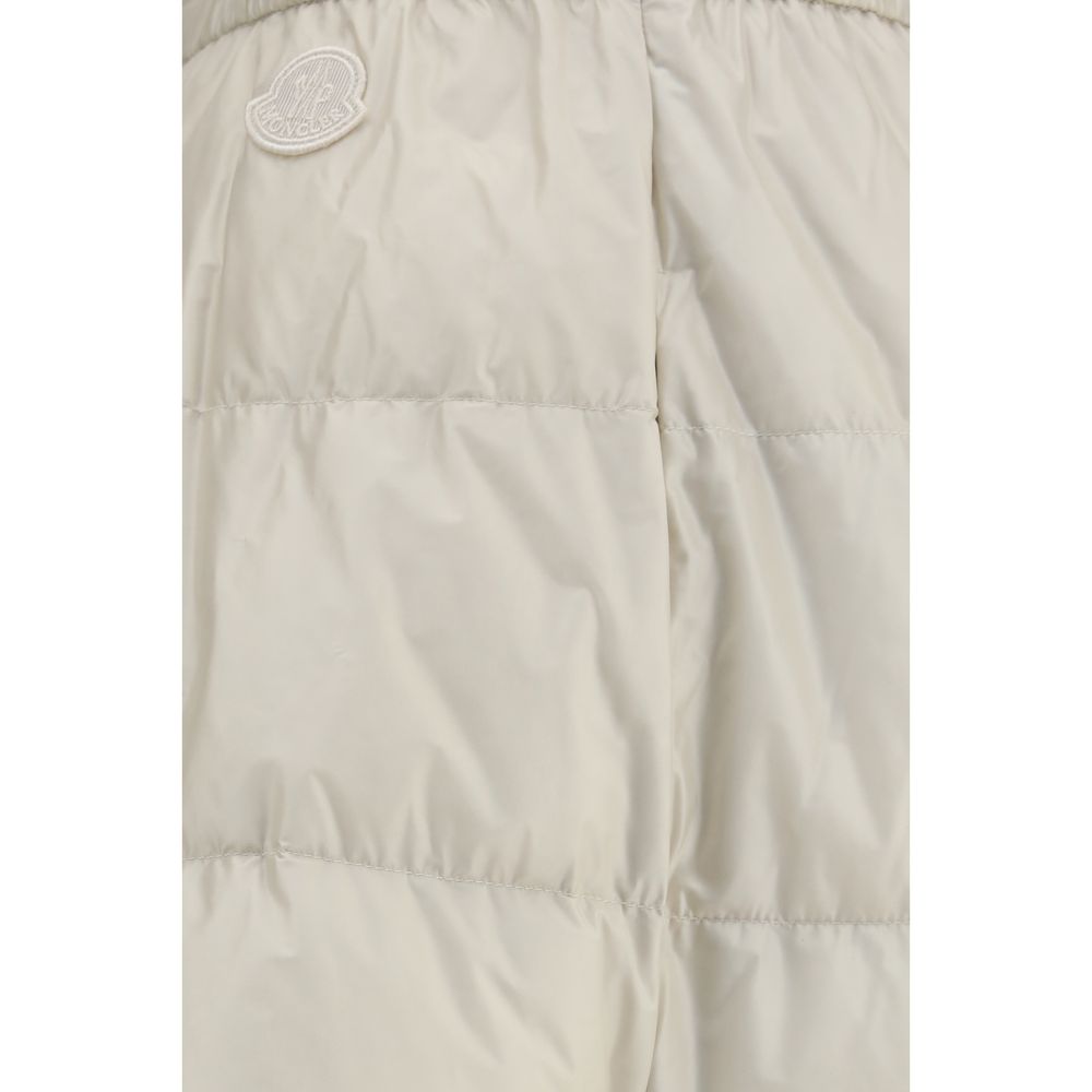 Elevate your wardrobe with the Moncler Beige Nylon Midi Skirt, a quilted masterpiece of luxury and sophistication, perfect for timeless elegance and refined style.