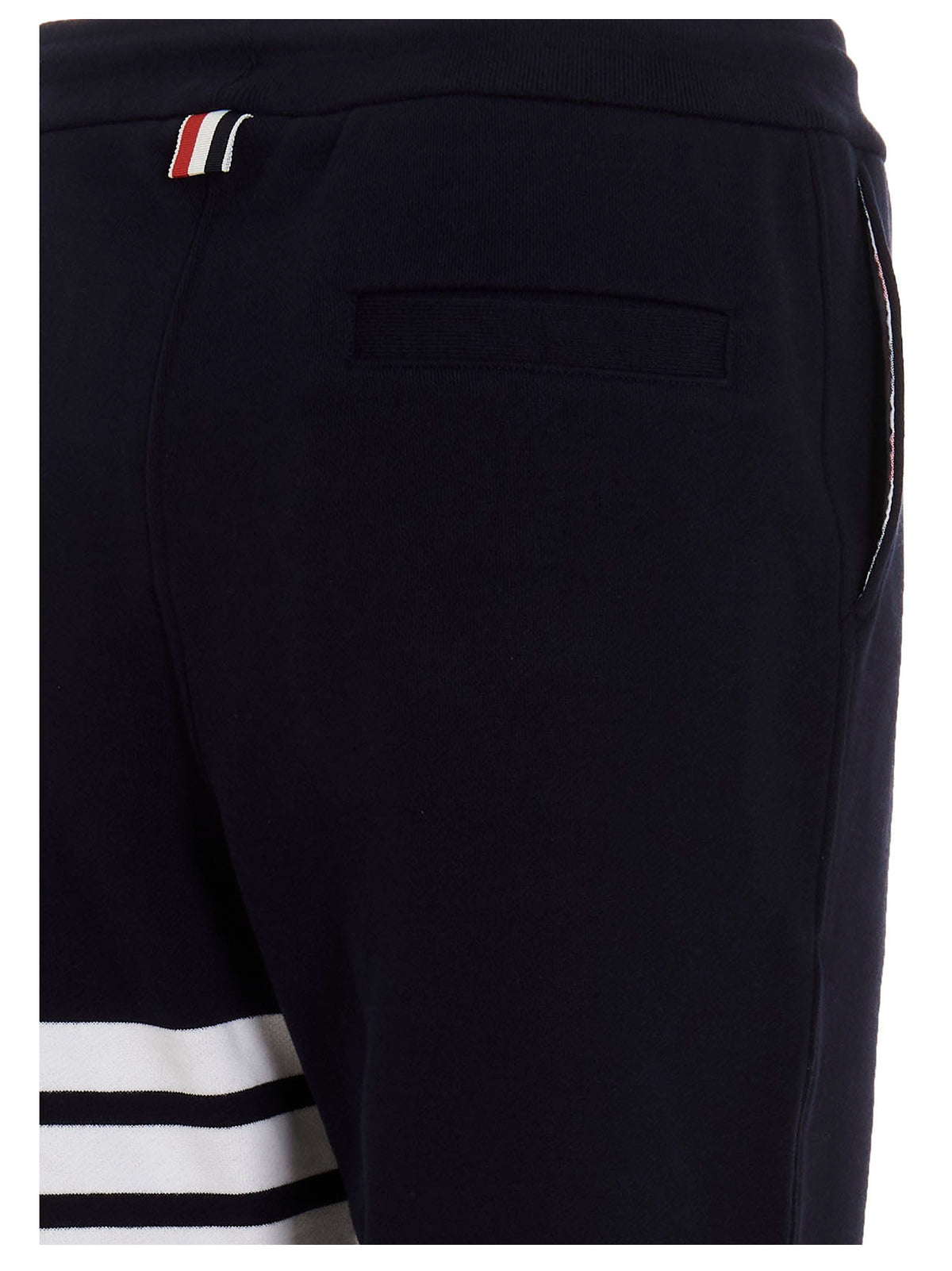 Indulge in the exquisite craftsmanship of Thom Browne's Blue Cotton Joggers, where luxurious comfort meets bold style, perfect for the discerning individual.