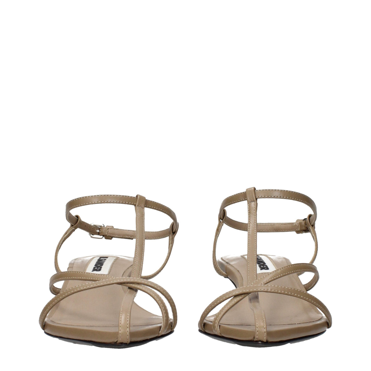 Discover the Jil Sander Beige Leather Flat Sandals, a timeless embodiment of elegance and minimalism, crafted for those who appreciate exquisite artistry in every step.