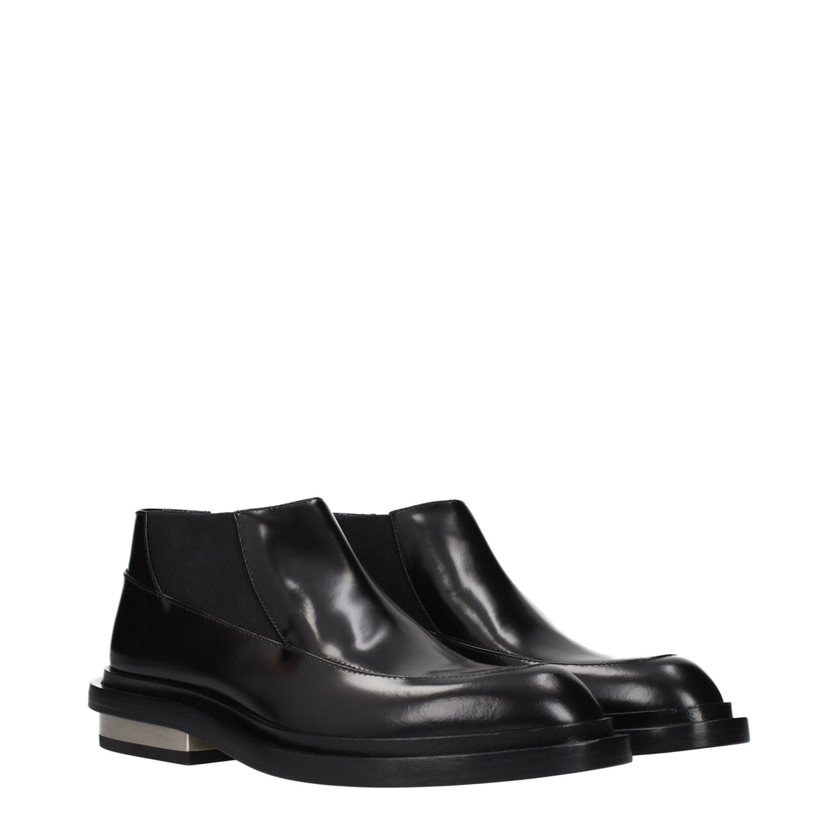 Experience the allure of Jil Sander Black Leather Ankle Boots, where exquisite craftsmanship meets timeless elegance, elevating your style with every step.