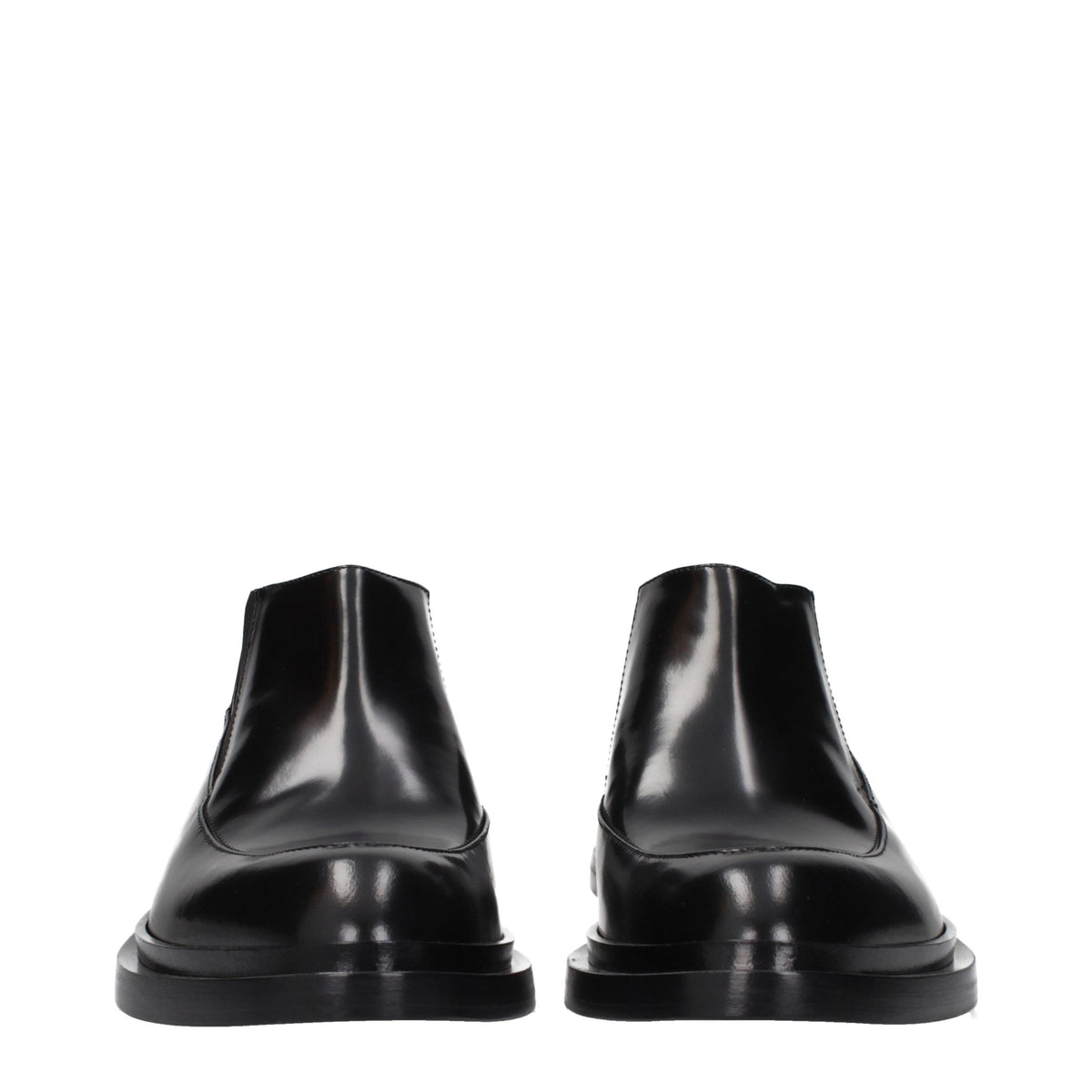 Experience the exquisite allure of Jil Sander Black Leather Ankle Boots, where timeless elegance meets masterful craftsmanship for the discerning connoisseur.