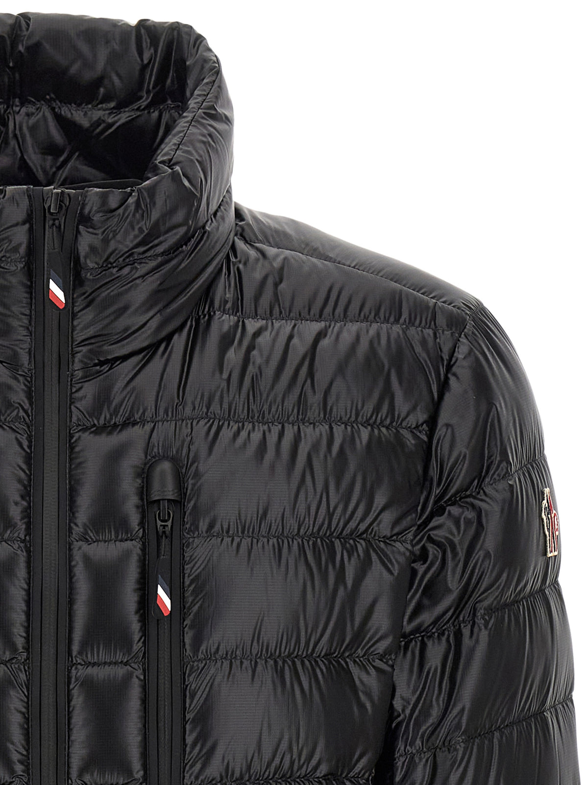 Discover the Moncler Grenoble Black Polyester Full-Length Jacket, a masterpiece of luxury outerwear that combines refined craftsmanship with contemporary elegance for the discerning individual.