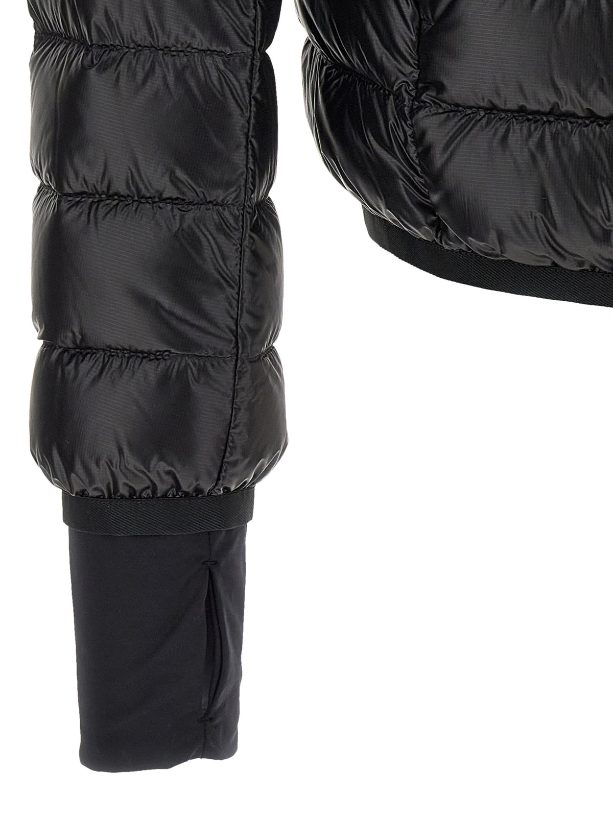 Discover the Moncler Grenoble Black Polyester Full-Length Jacket, a masterpiece of craftsmanship and style, designed to elevate your winter wardrobe with luxurious warmth and elegance.