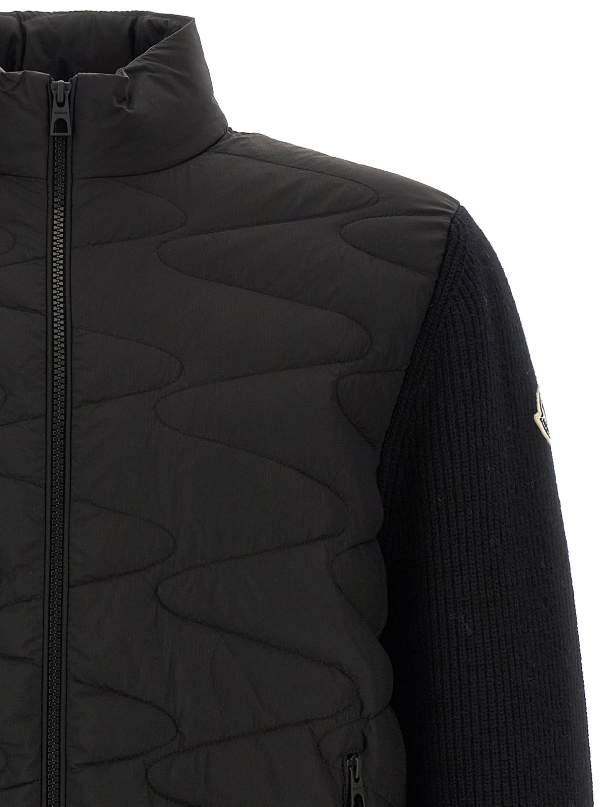 Discover the Moncler Black Polyamide Cardigan, a luxurious blend of technical fabric and virgin wool, designed for those who appreciate timeless elegance and exquisite craftsmanship.