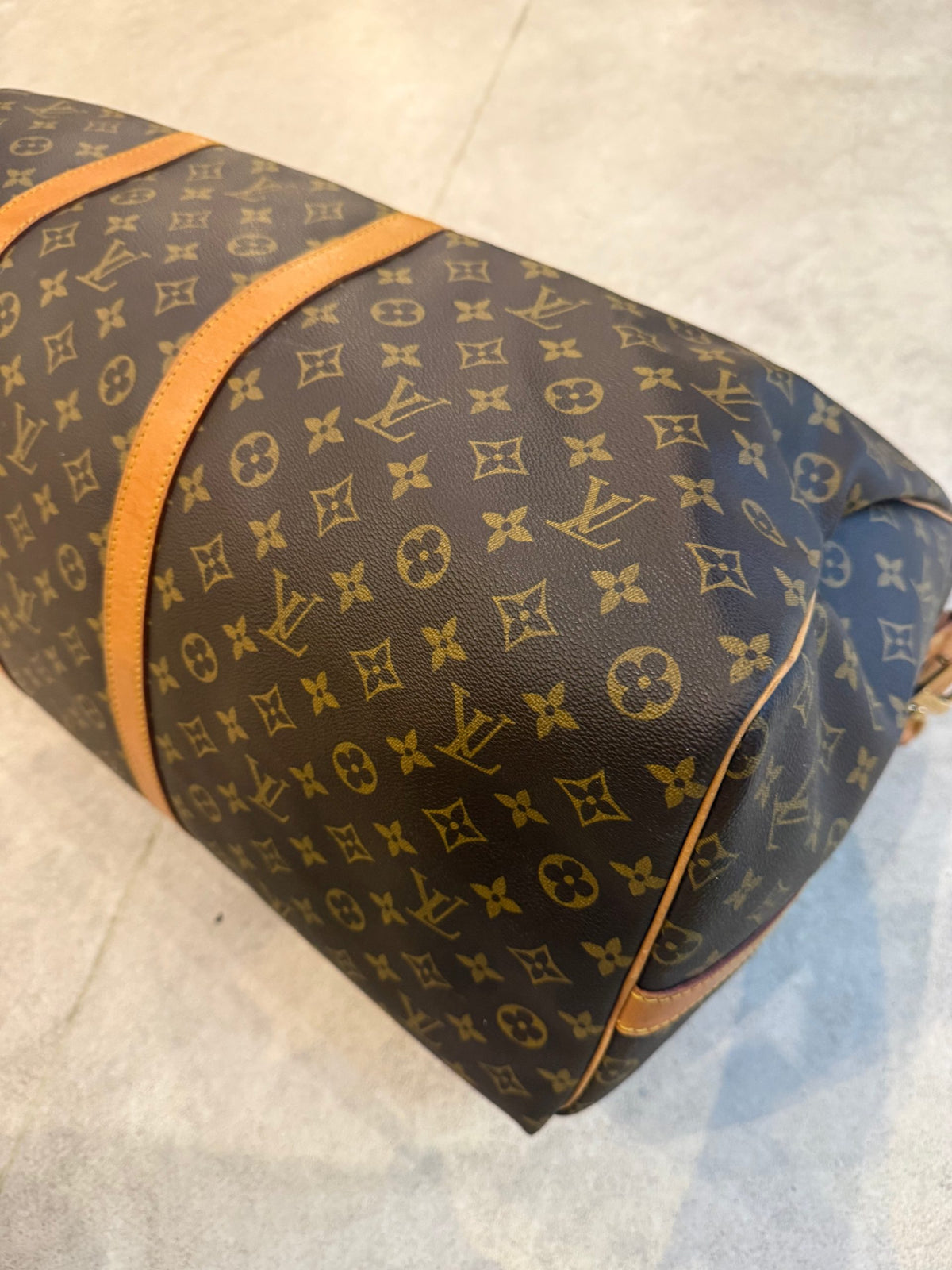 Elevate your journey with the Louis Vuitton KEEPALL 60 Monogram, a timeless duffel that embodies exquisite craftsmanship and luxurious versatility for the discerning connoisseur.