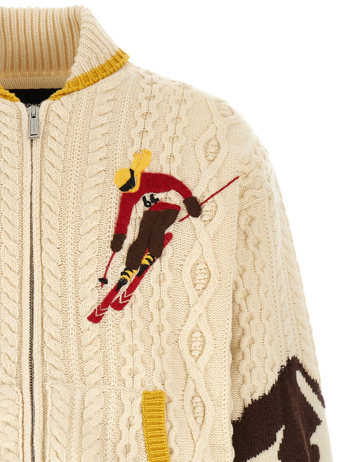 Indulge in the DSQUARED2 'Snowy Dream' cardigan, a luxurious 100% wool piece featuring intricate detailing and a striking mountain pattern, perfect for après-ski elegance.