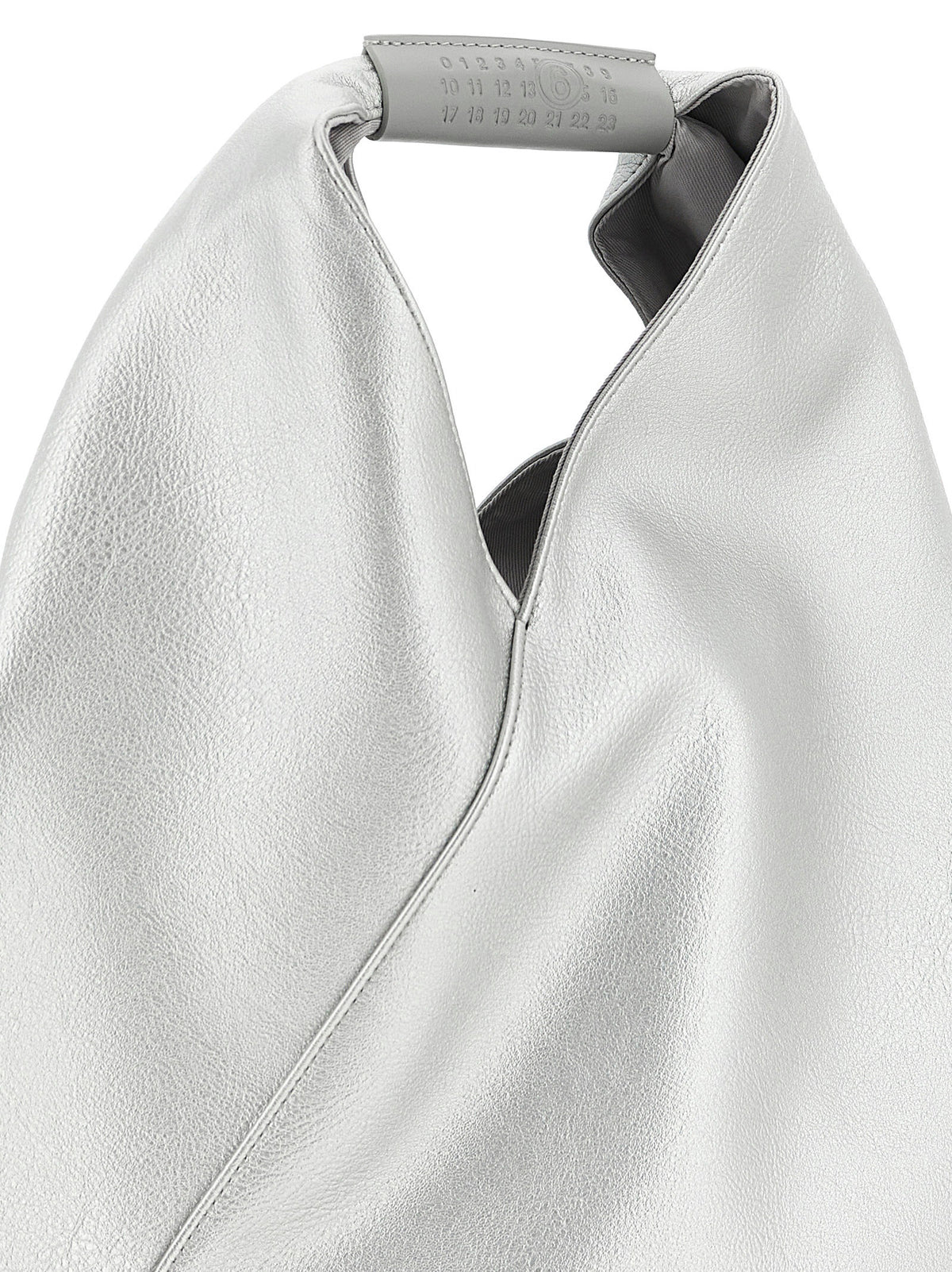 Elevate your style with the MM6 Maison Margiela Silver Polyethylene Handbag, a masterpiece of craftsmanship that embodies sophistication and modern elegance.