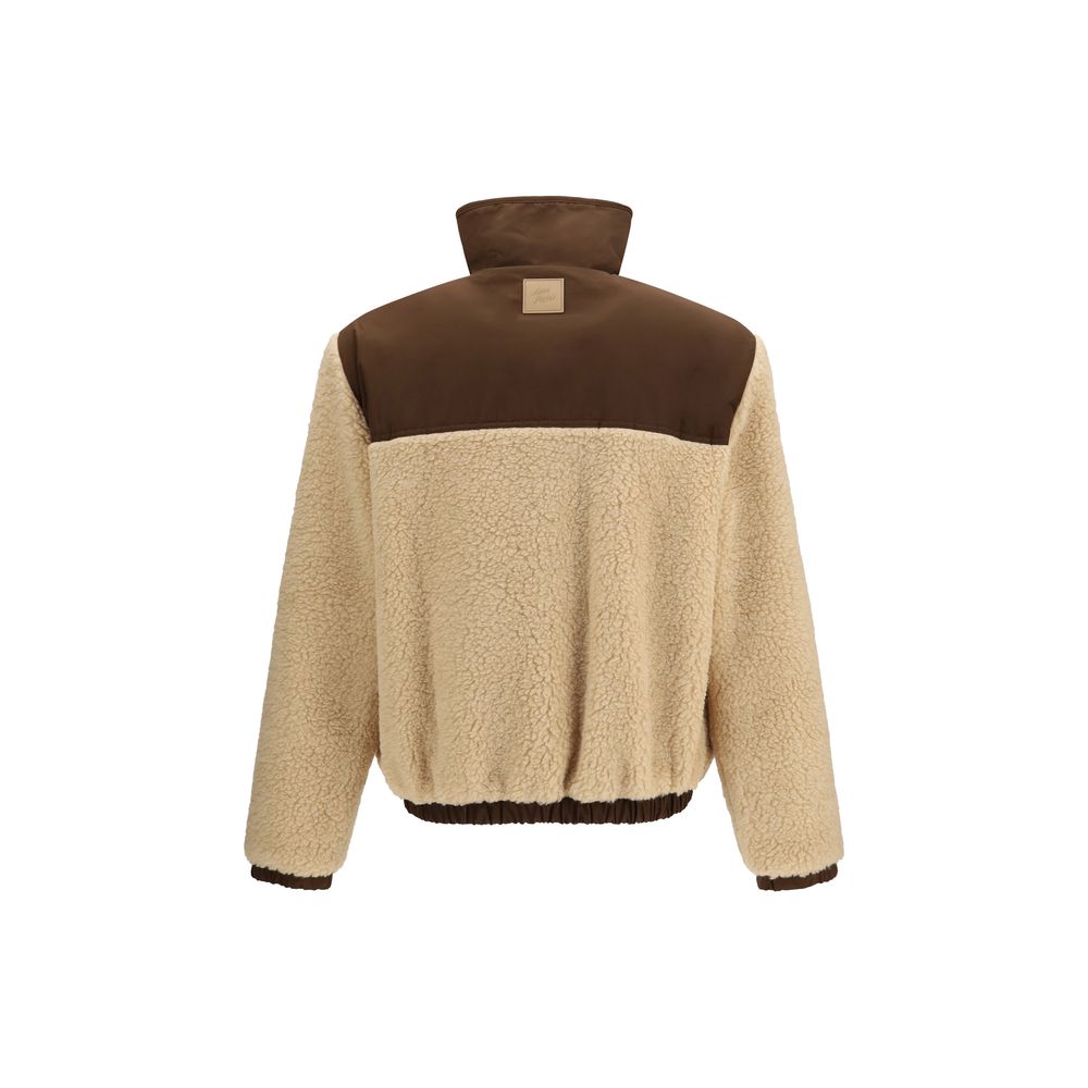 Indulge in the Ami Paris Beige Polyester Full-Length Jacket, a blend of luxurious fleece and nylon, embodying sophistication and style for the discerning individual.