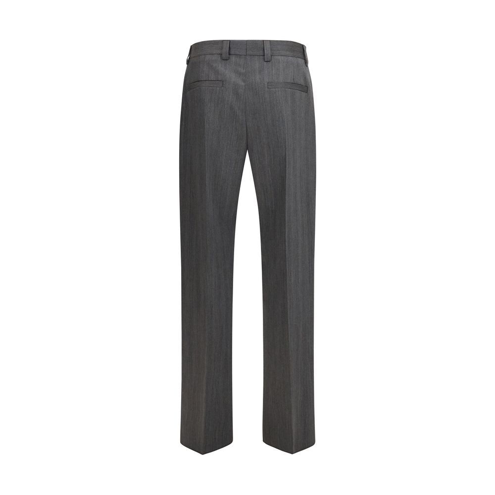 Elevate your wardrobe with Valentino Garavani's Gray Wool Oves Aries Dress Pants, crafted from pure virgin wool, embodying refined elegance and timeless sophistication.