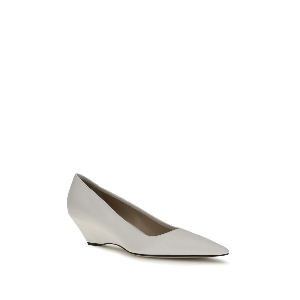 Elevate your style with The Row's White Lamb Ovis Aries Platform Pumps, crafted from luxurious lambskin, embodying refined elegance for the discerning individual.