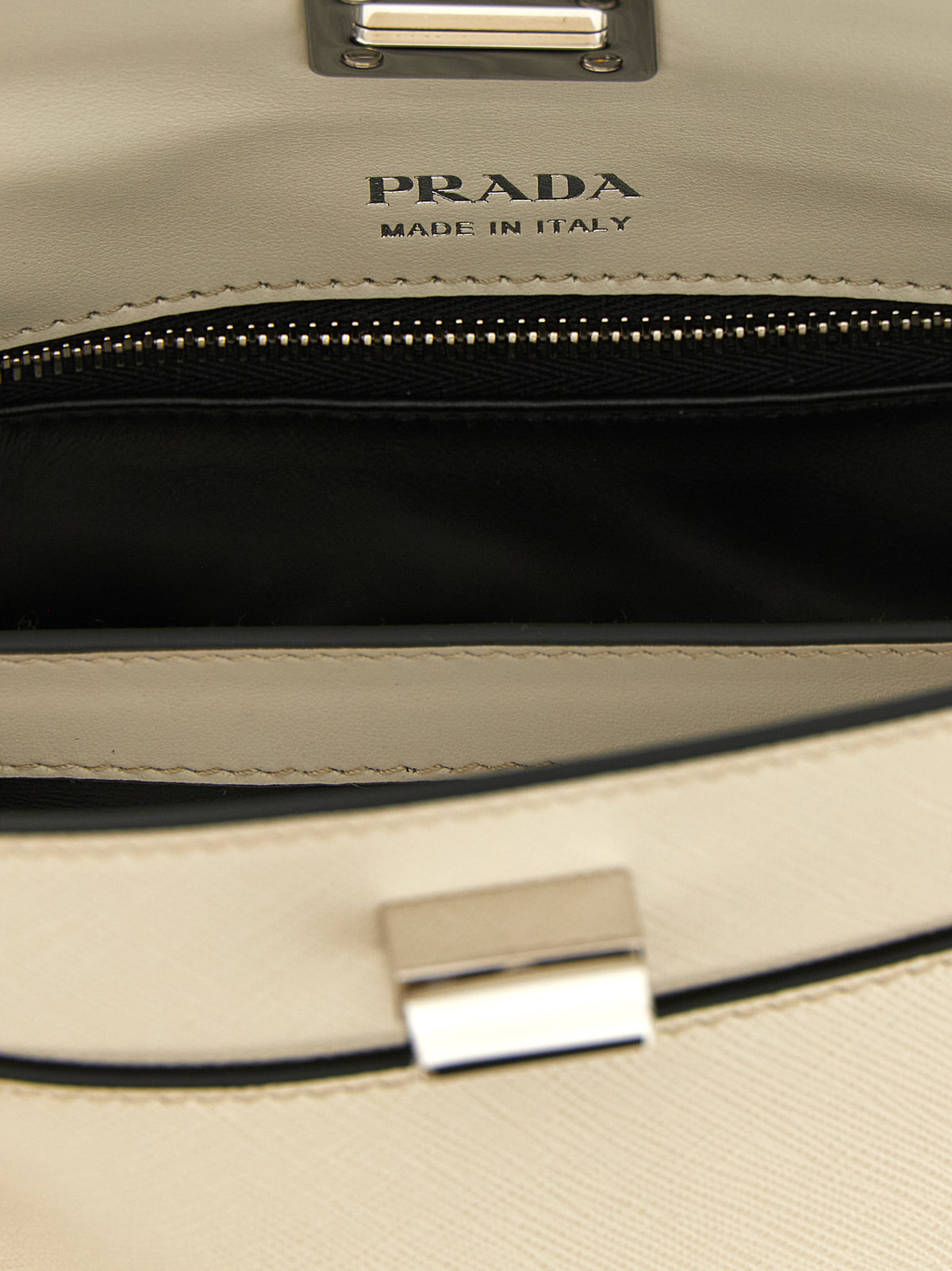Elevate your style with the Prada White Calfskin Handbag, a masterpiece of Italian craftsmanship in luxurious calf leather, perfect for the discerning individual.