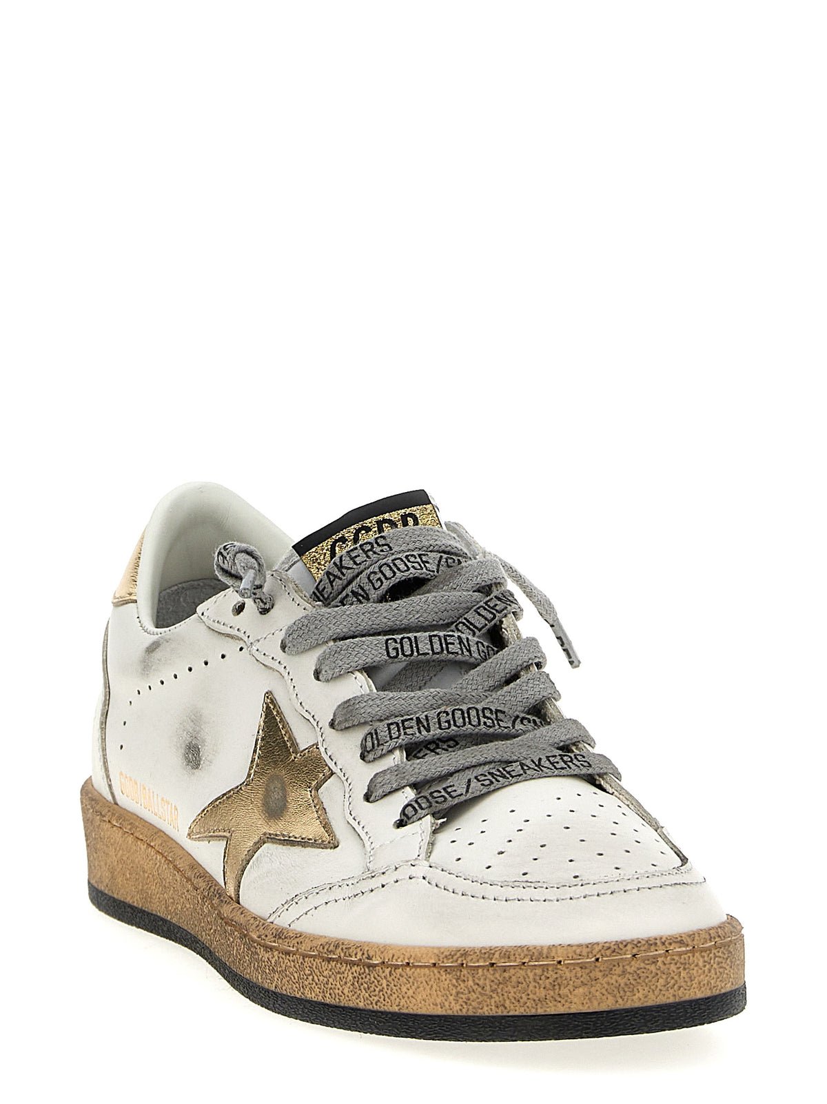 Step into luxury with Golden Goose Gold Cowhide Low Top Sneakers, where Italian craftsmanship meets bold design, perfect for elevating any wardrobe.